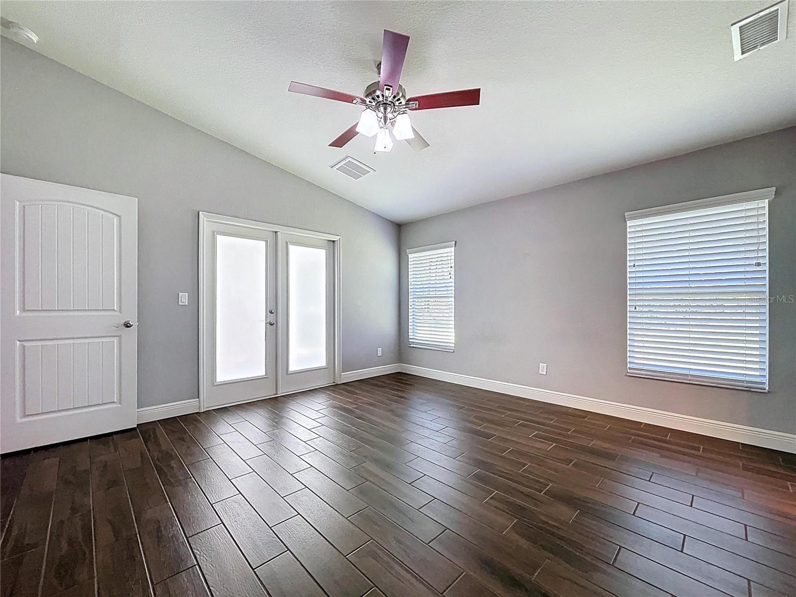 Split floor plan provides privacy for primary bedroom.