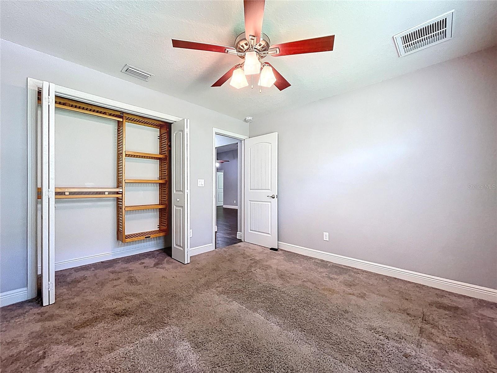 Custom closet system in bedroom one.