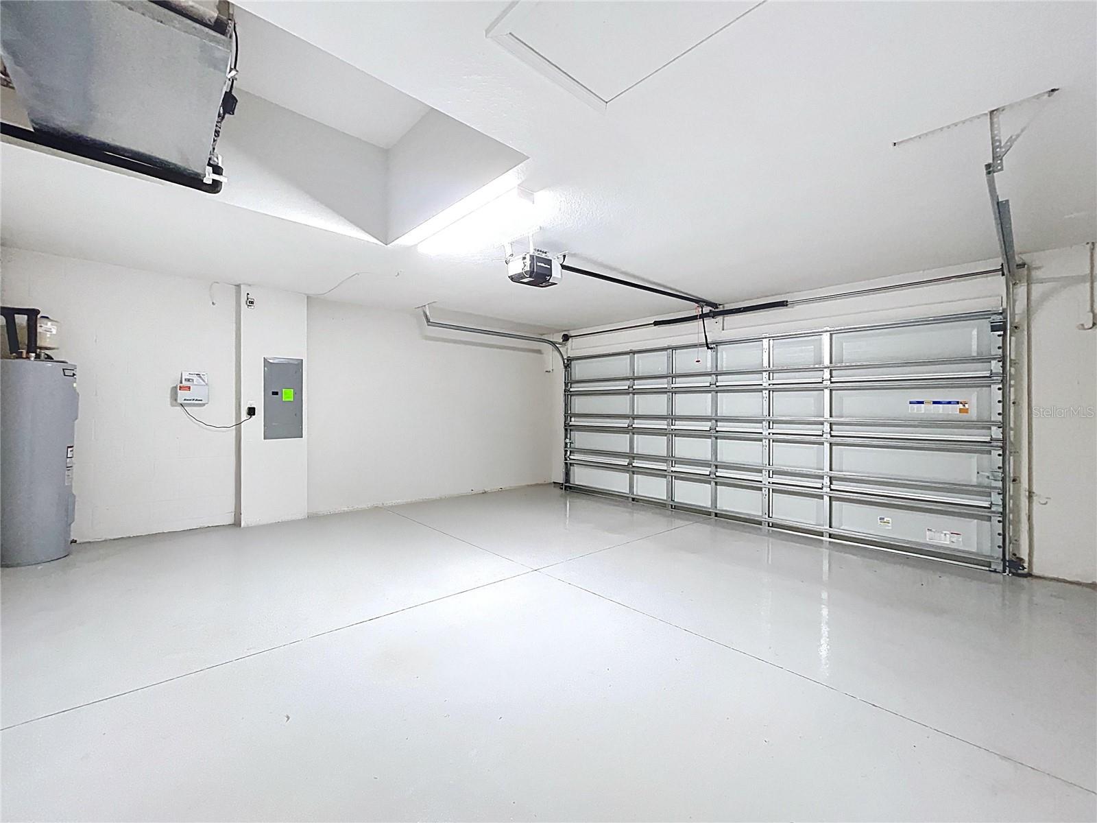 Two-car garage with professionally sealed epoxy floors.