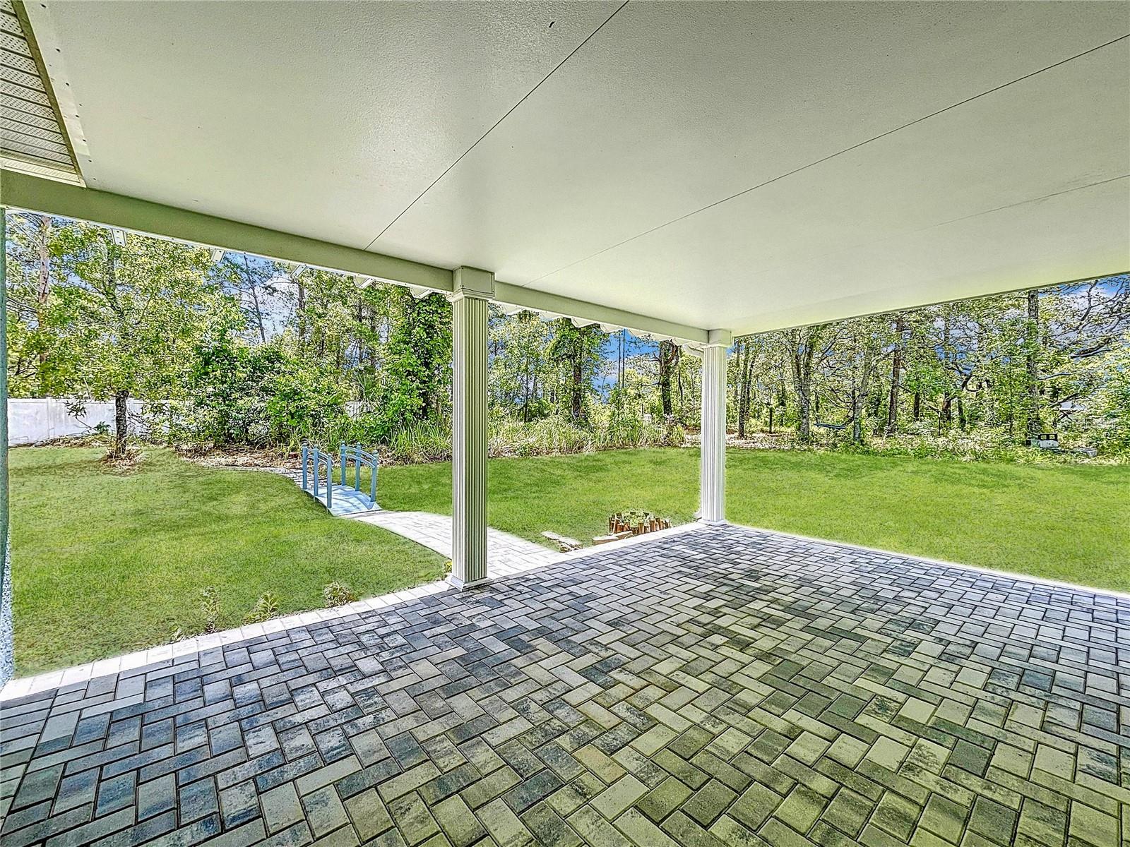 Covered back lanai with freshly sealed pavers.