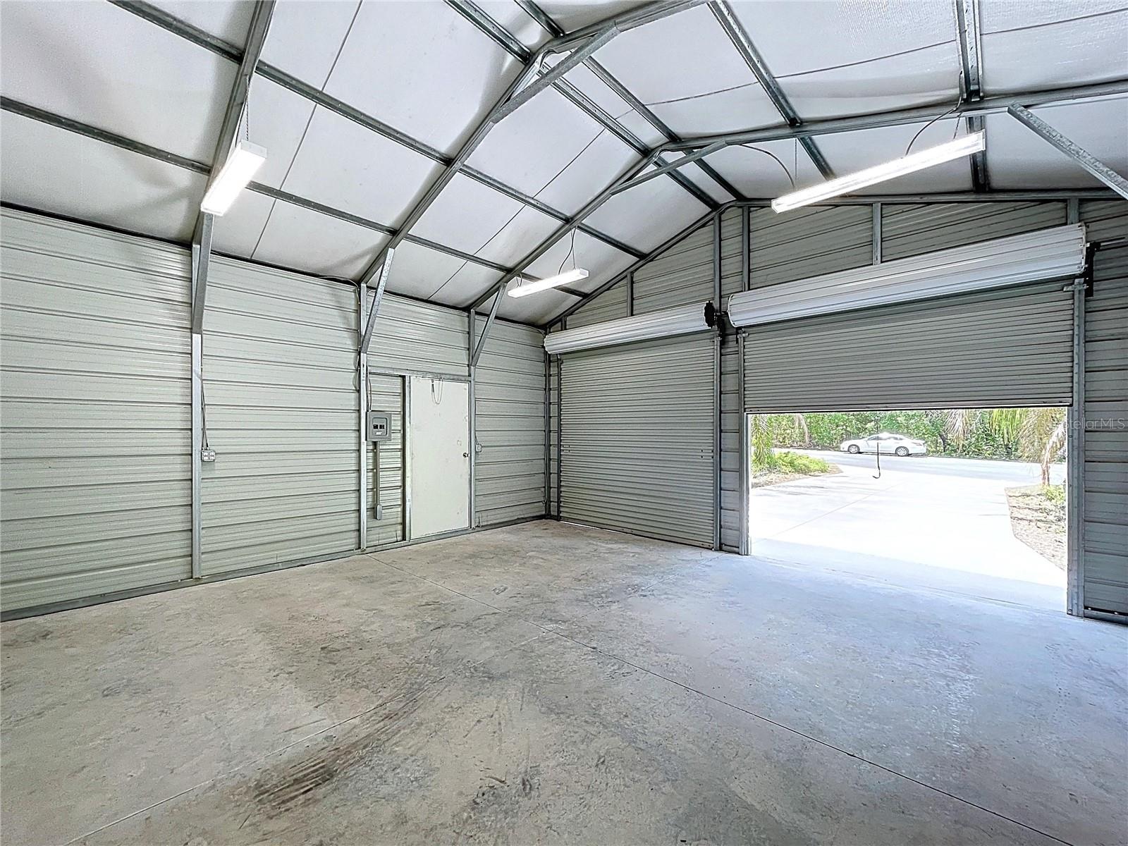 Two roll-up doors for easy access to garage.
