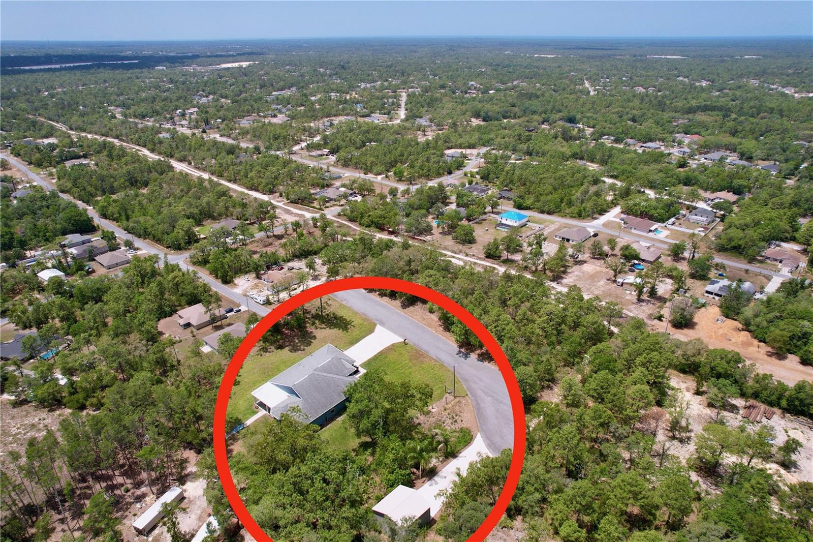 Two concrete driveways with plenty of parking.
