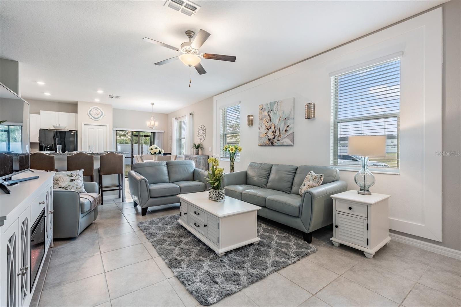 Spacious living area with Tile floor and light bright space!