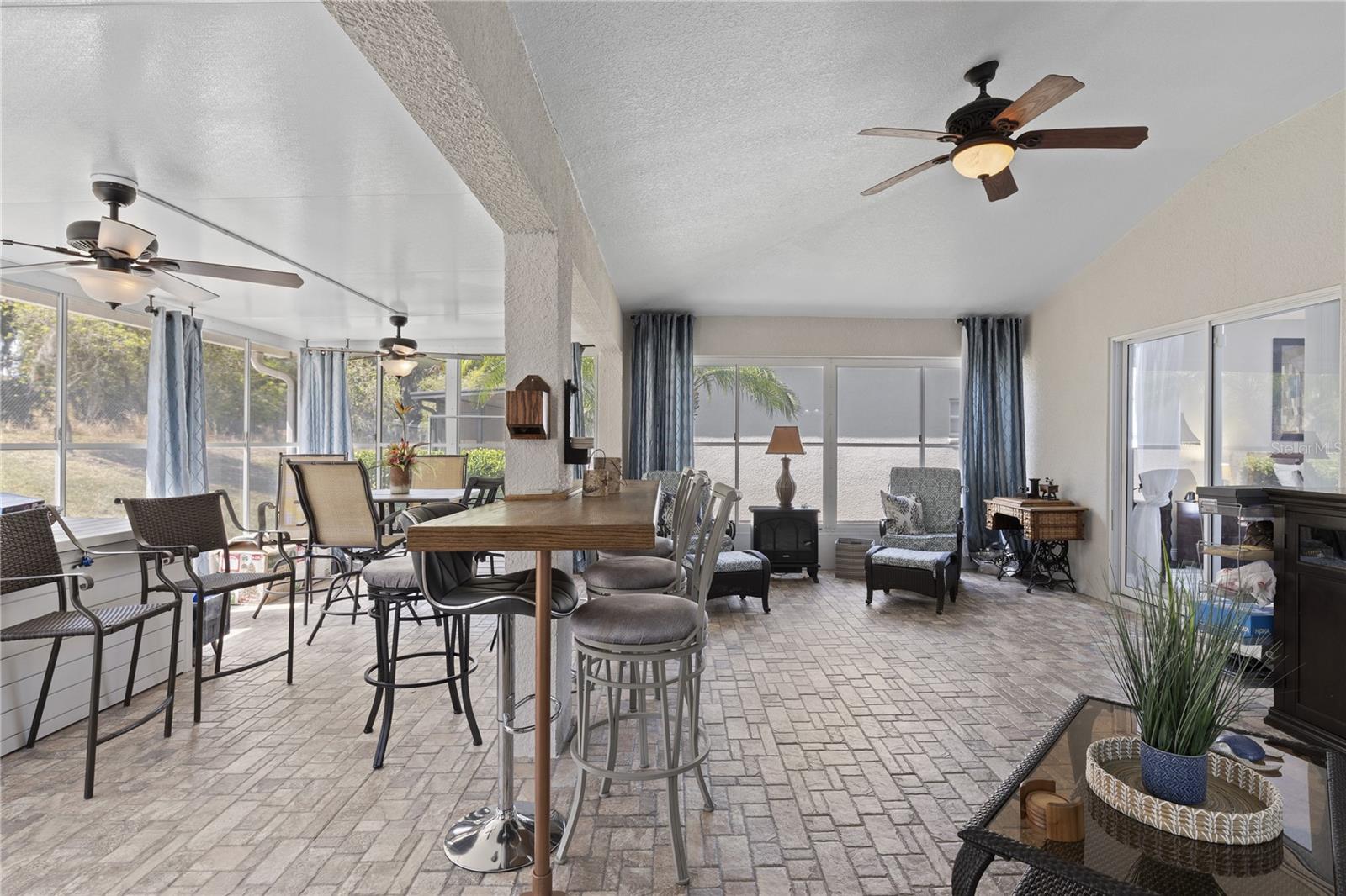 paver floor with slider windows and access from owners suite and family room