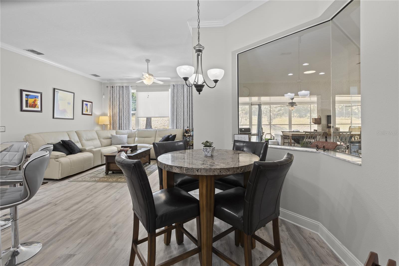 Eat in nook with miter glass window OPEN to leisure room