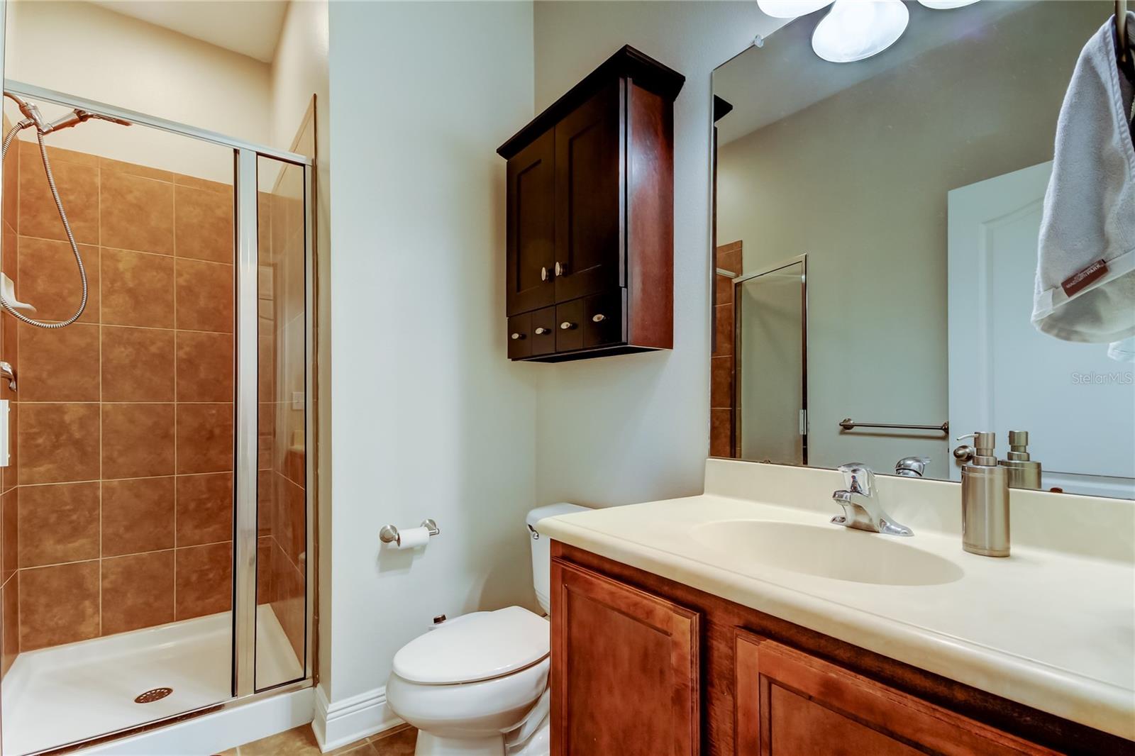 downstairs full bathroom with shower