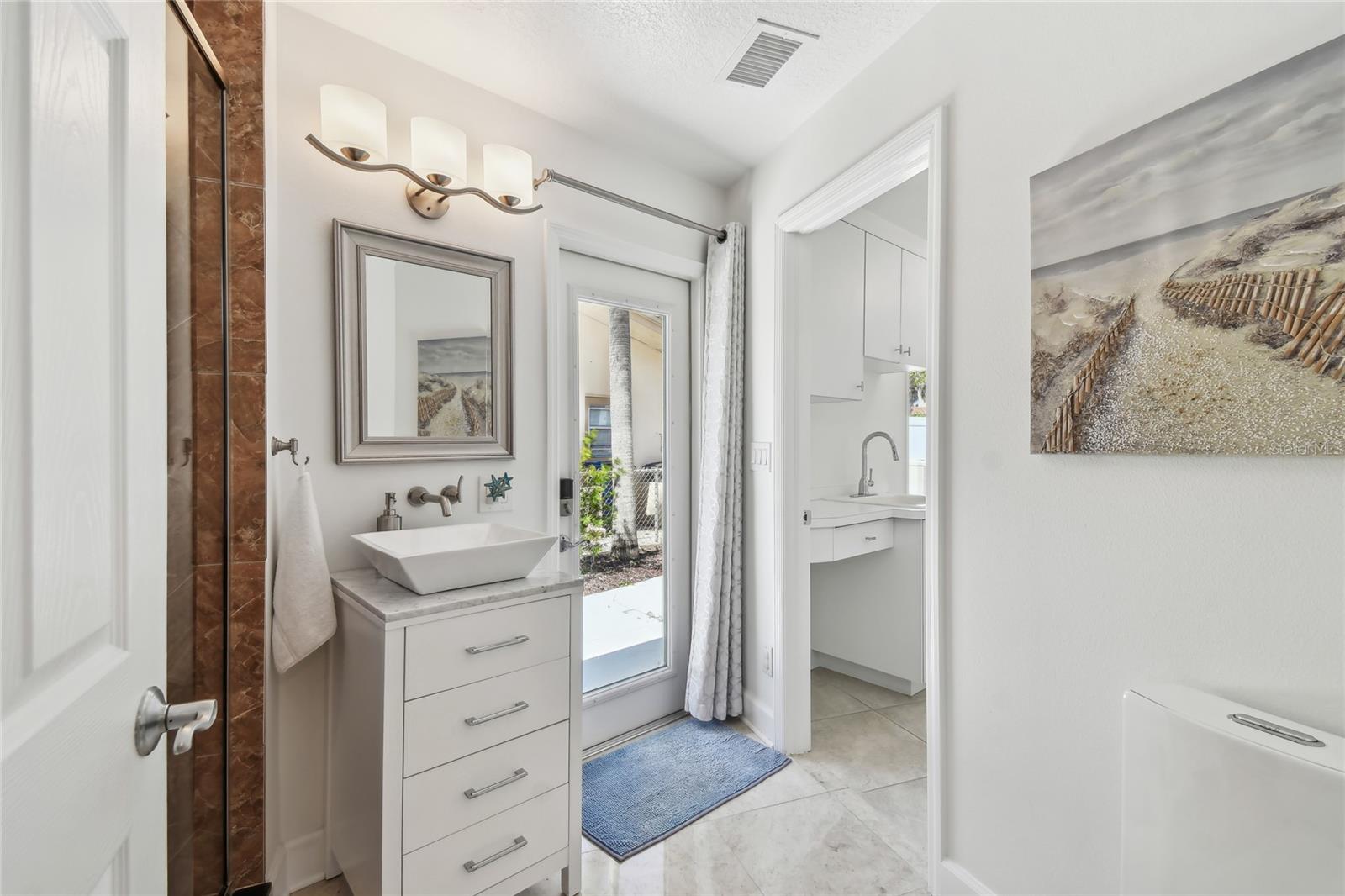 Pool bath, laundry entranceway