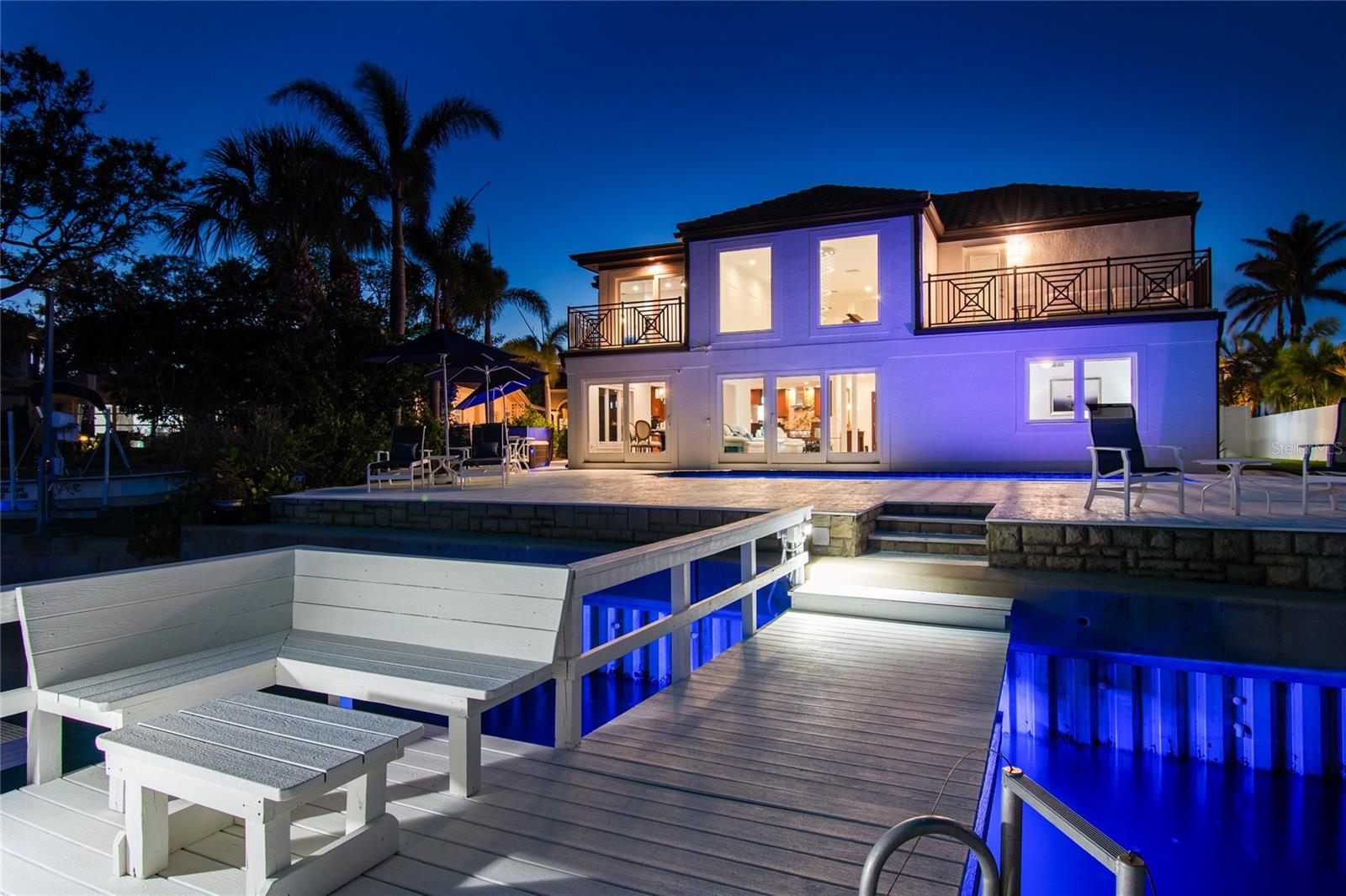 Evening lighting illuminates this coastal retreat