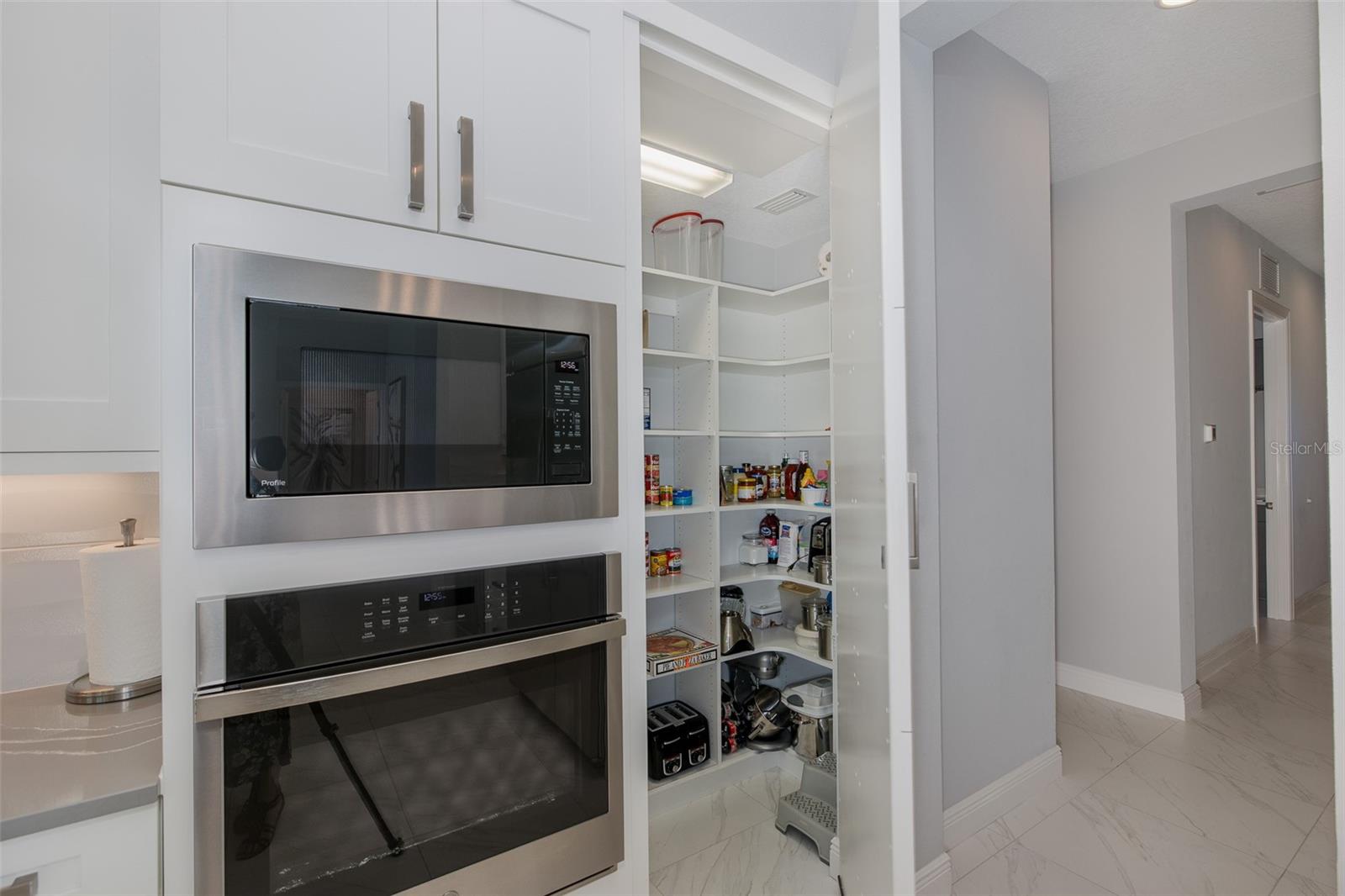 Hidden Pantry w/custom shelving!