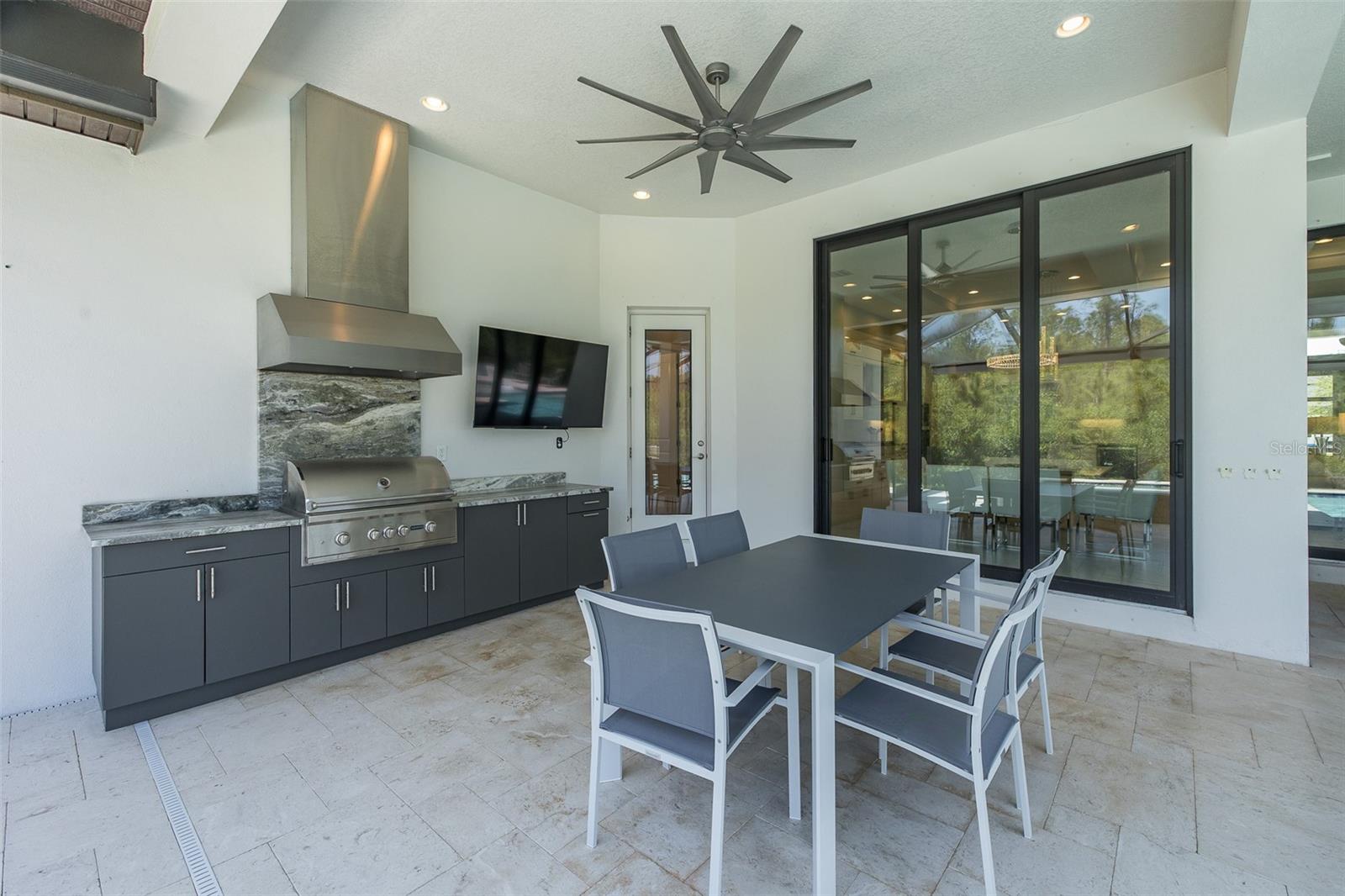 Summer Kitchen w/Custom Hood & Sleek Granite!