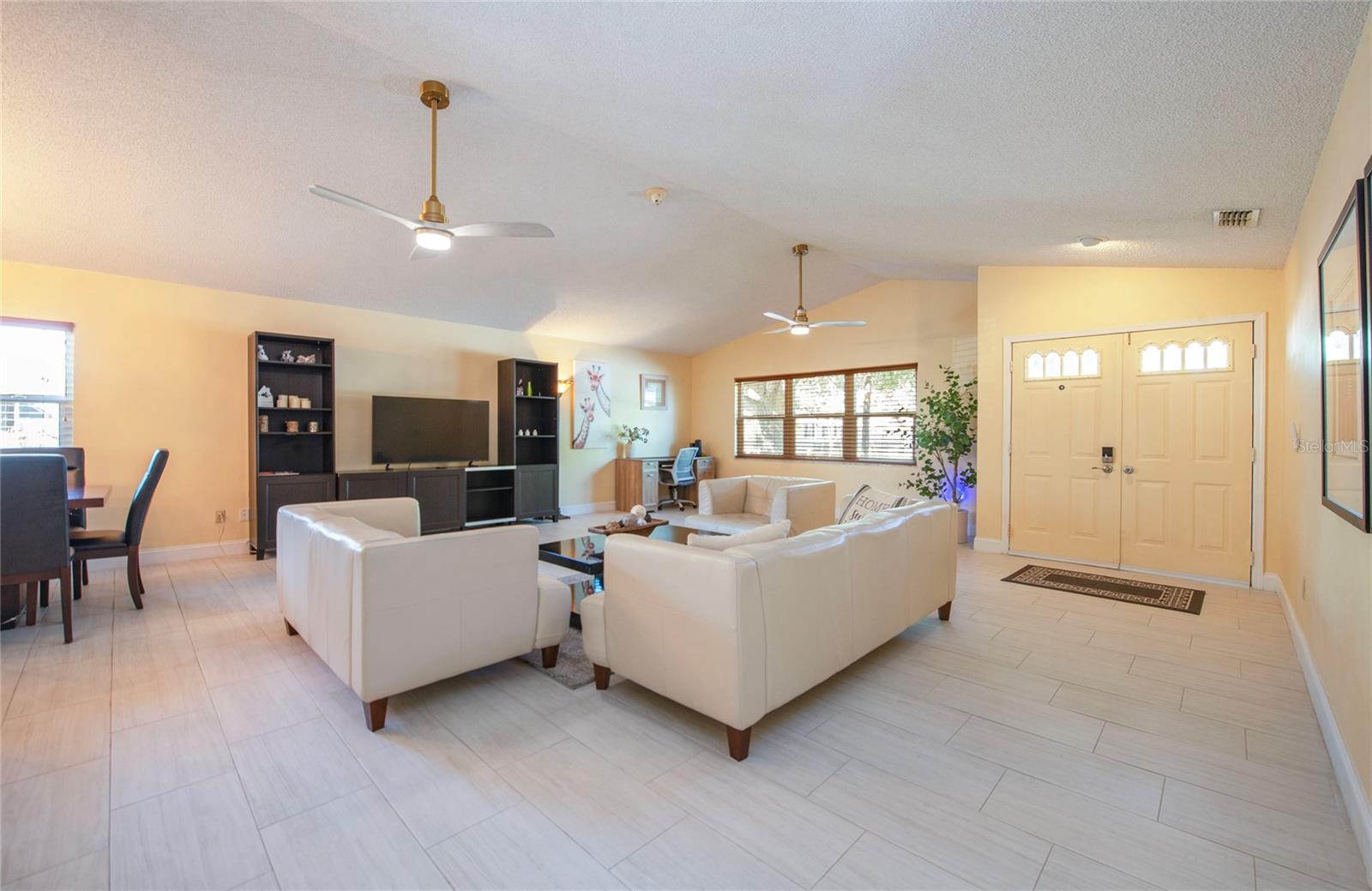 beautiful plank tile throughout the home and high ceilings
