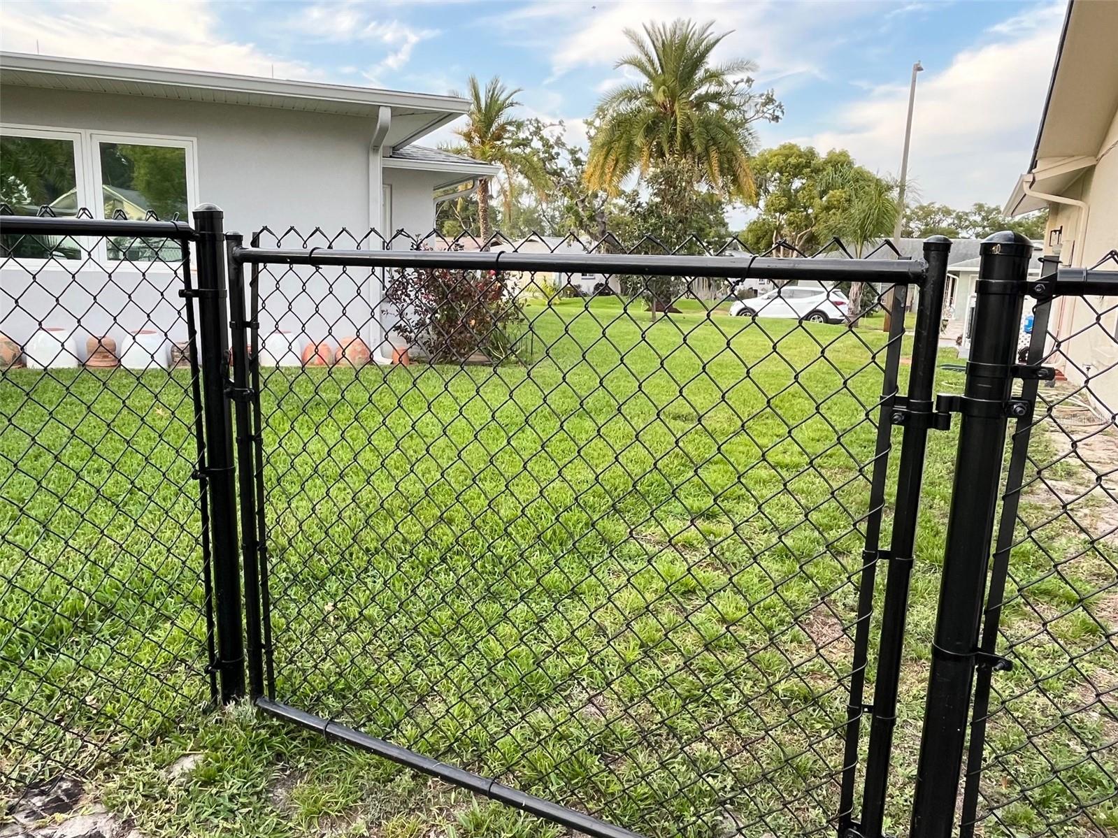 New chain link fence around backyard