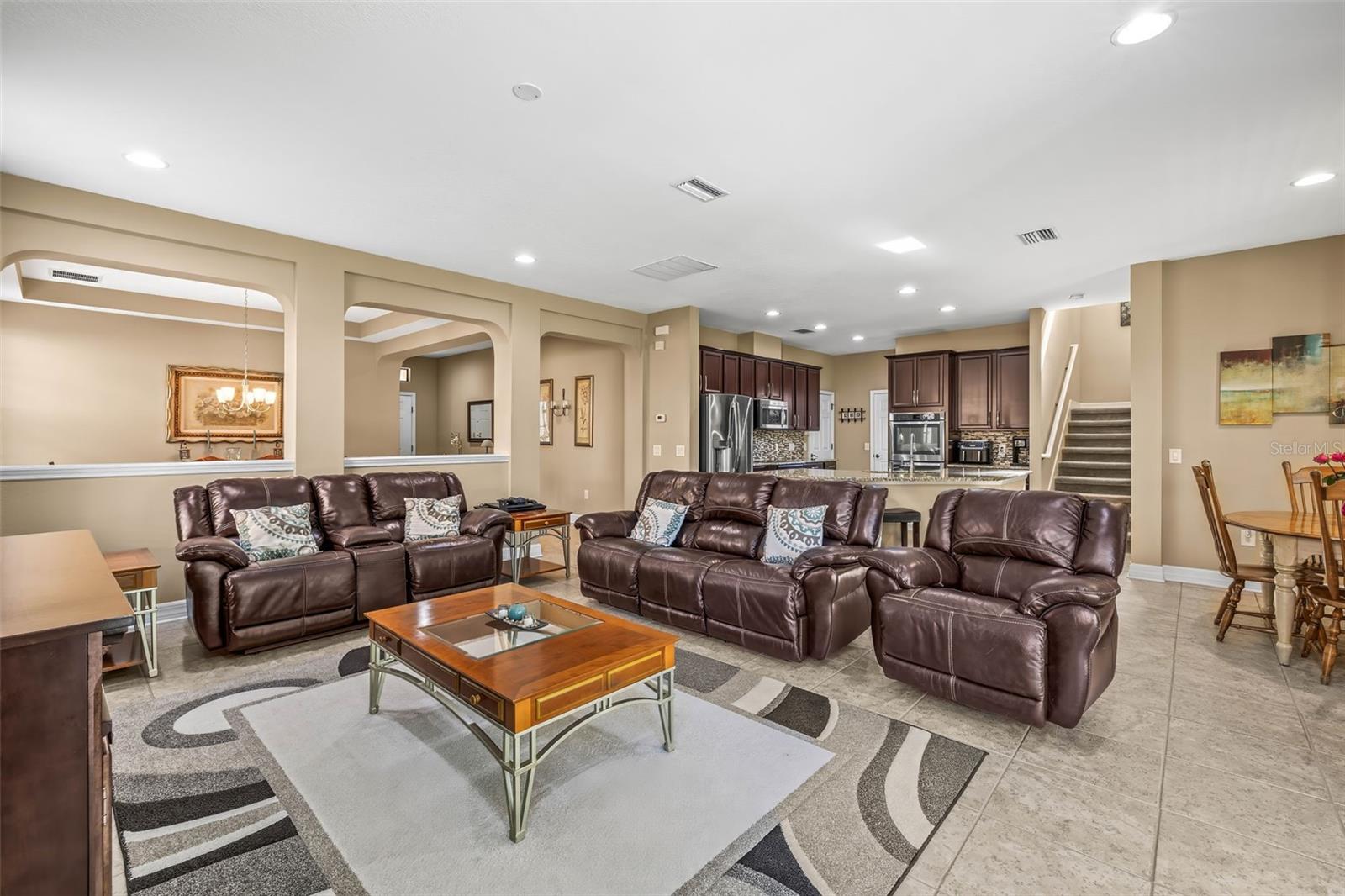 Great room looking toward the kitchen with a peek of the formal dining area.