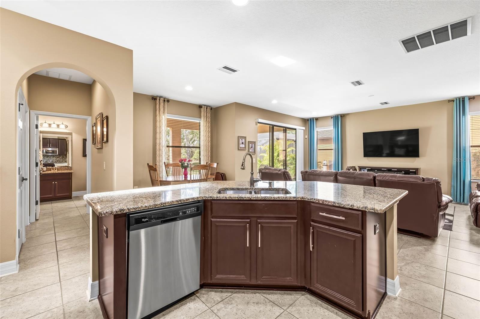 Stainless steel appliances & views toward your dinette and living room.