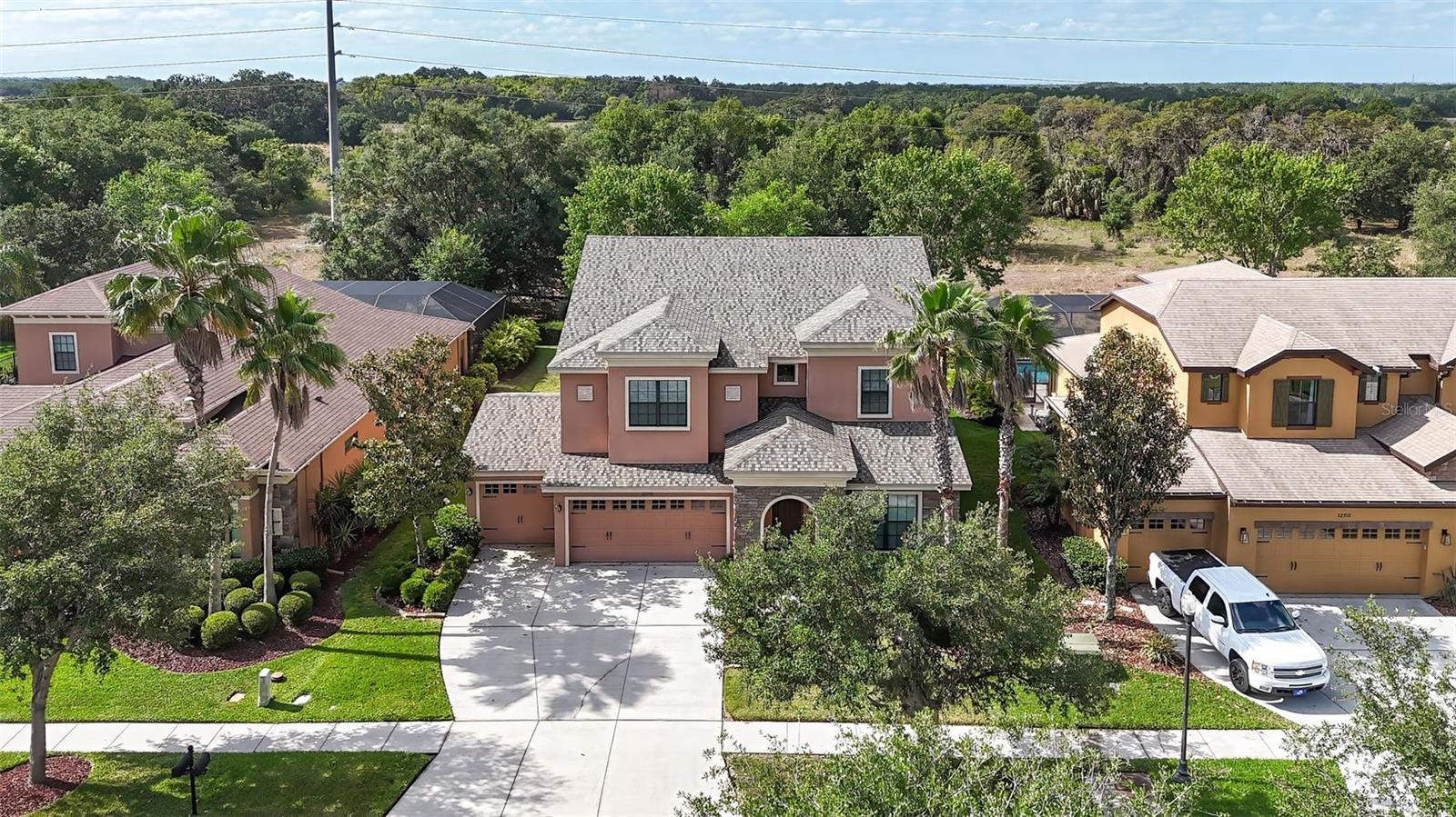 Mature landscaping surrounds this home.