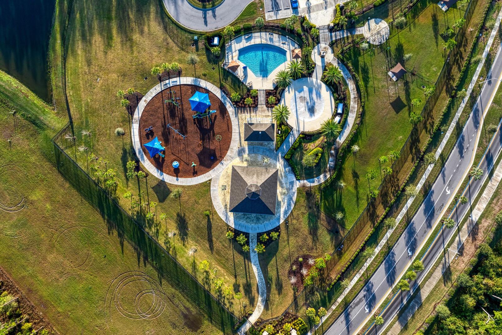 Promenade Park with dog park, splash pad, pool, playground, and classes held year round!