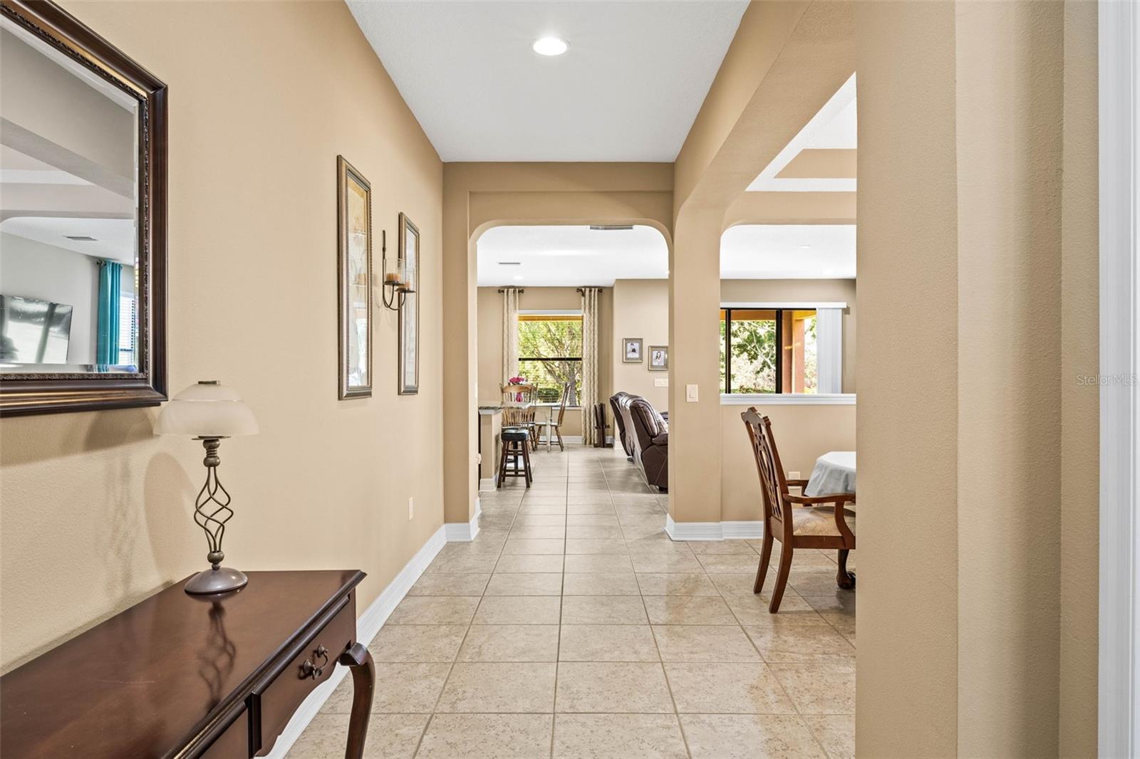 Your entryway leads to the front office to the immediate R side with views toward the formal dining room and great room/kitchen.