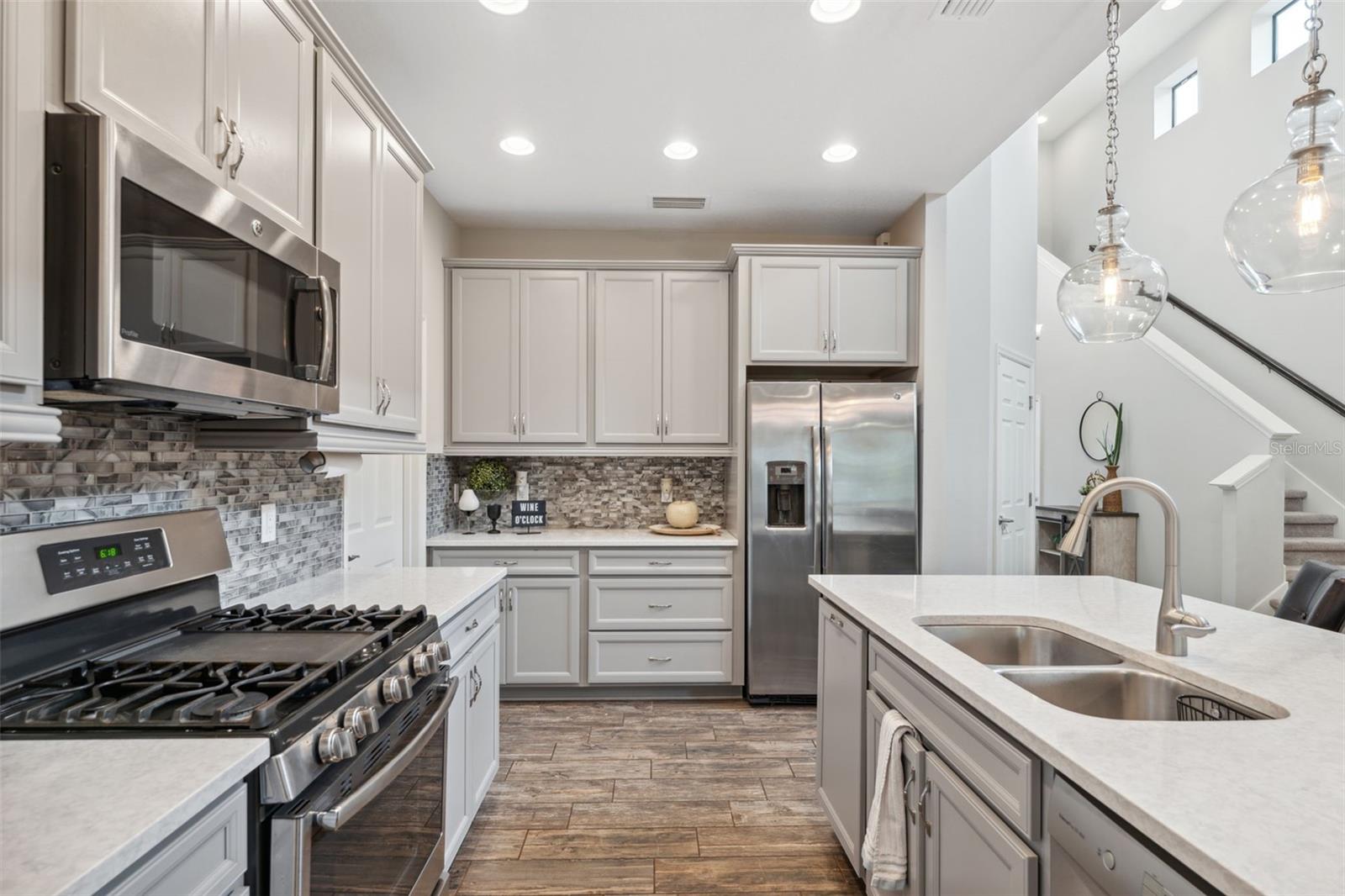 Beautiful premium cabinets, Tile flooring and quartz counters