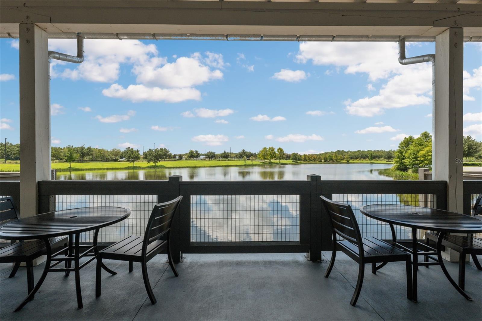 Shaded waterfront tables to relax, work, or hand out