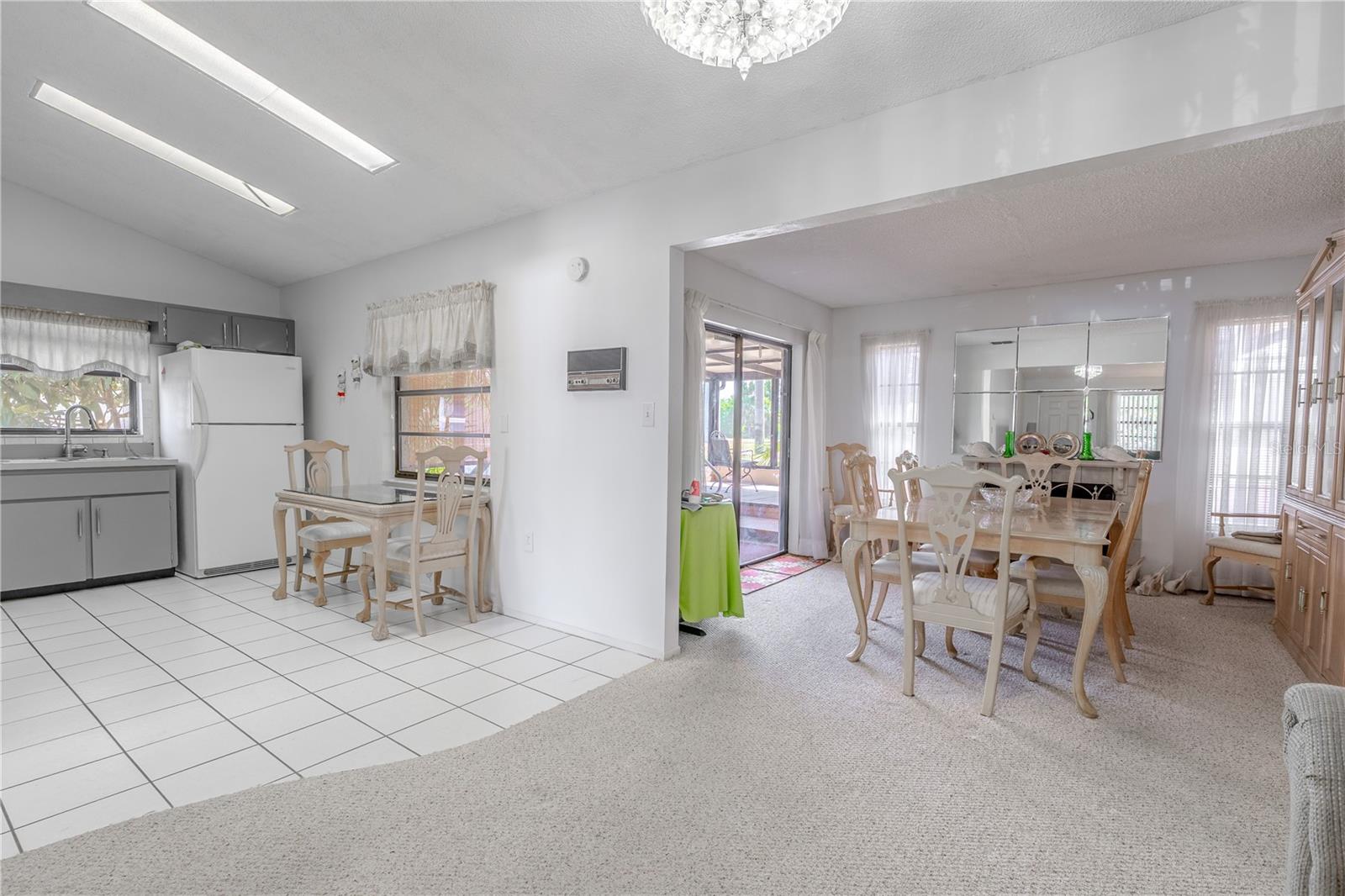 Just past the kitchen and dining area is a family room (currently used by the homeowner as their dining room)