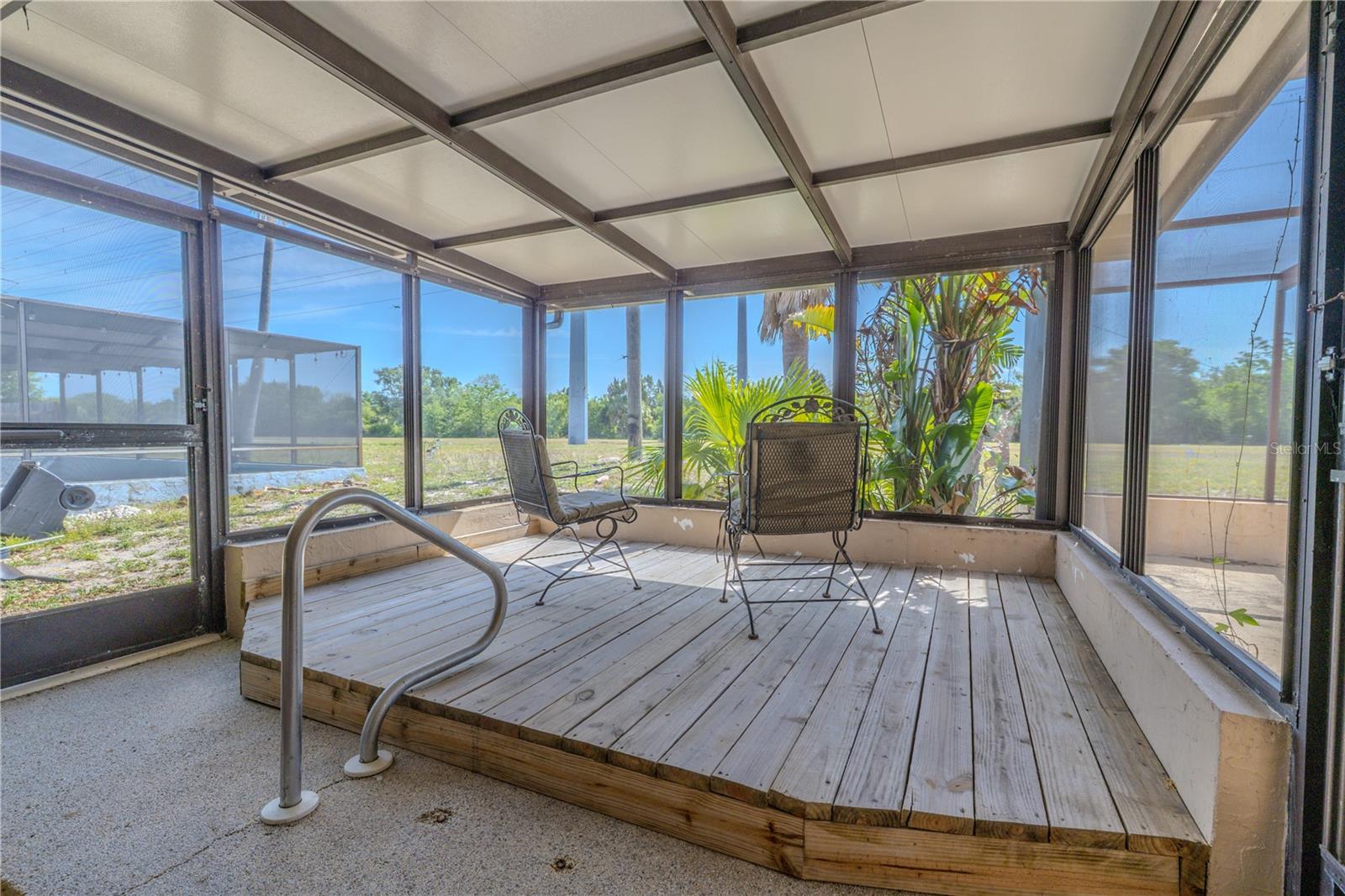The lanai. A wood deck was built over the in ground jacuzzi.