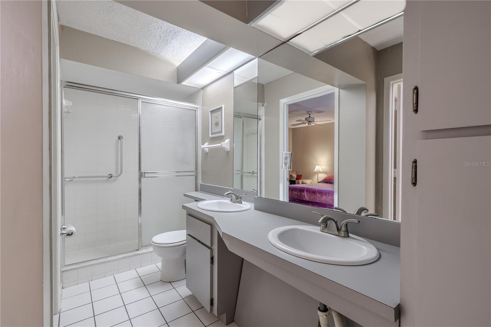 The primary bath features a tile floor and a step in shower.