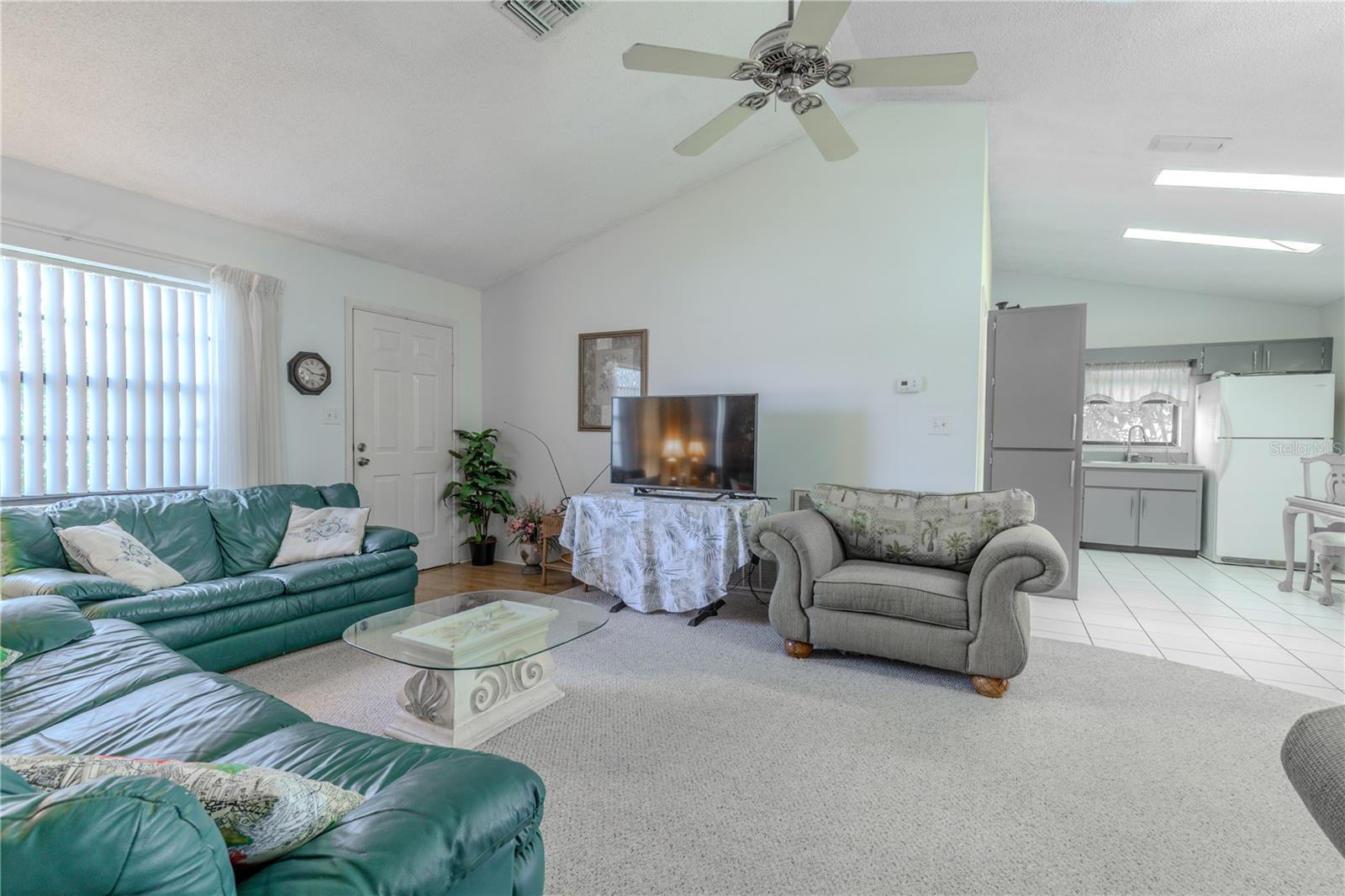 The living room and dining room are open to the kitchen.