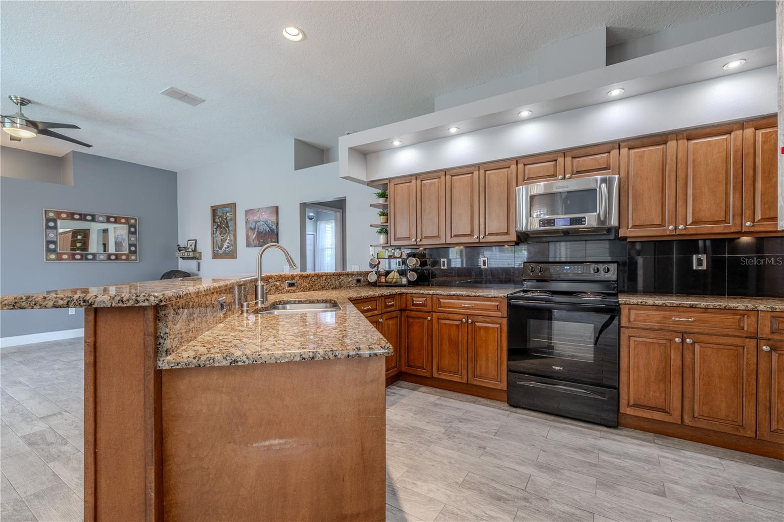 The kitchen has an abundance of cabinet and counter space.