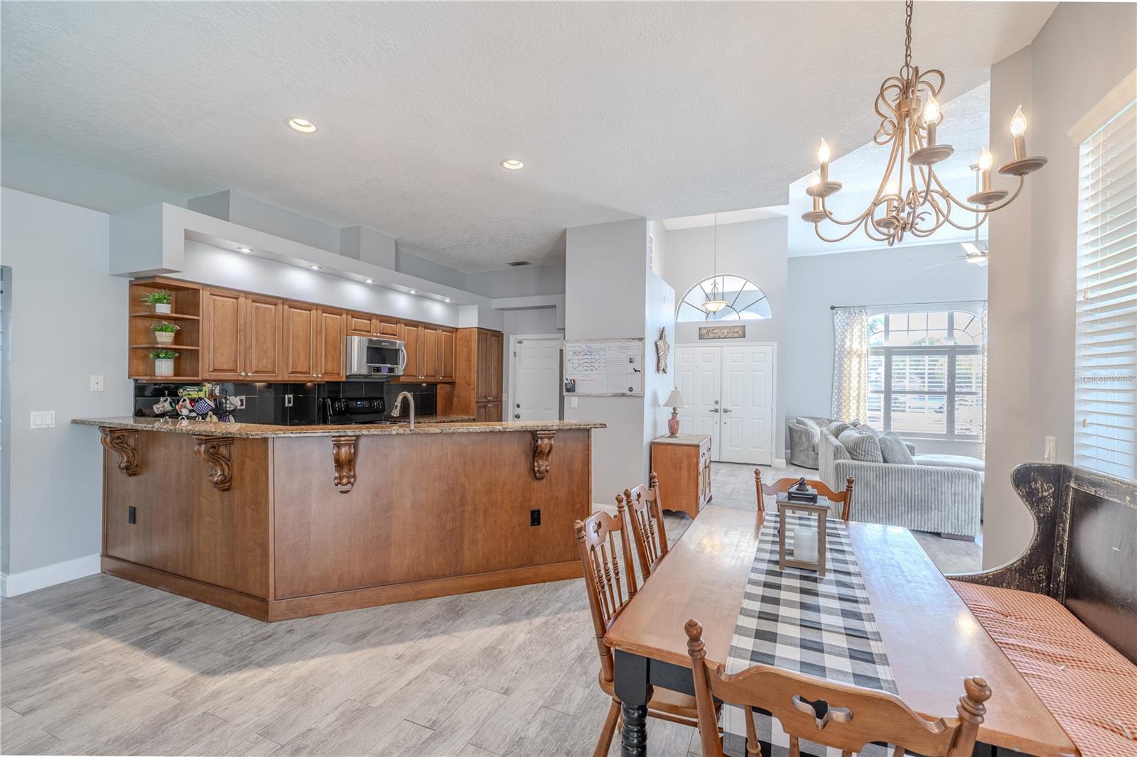 The kitchen features a spacious breakfast bar.