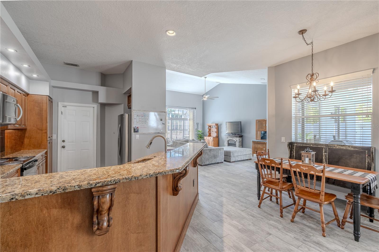 The kitchen, breakfast nook and a view of the living room.