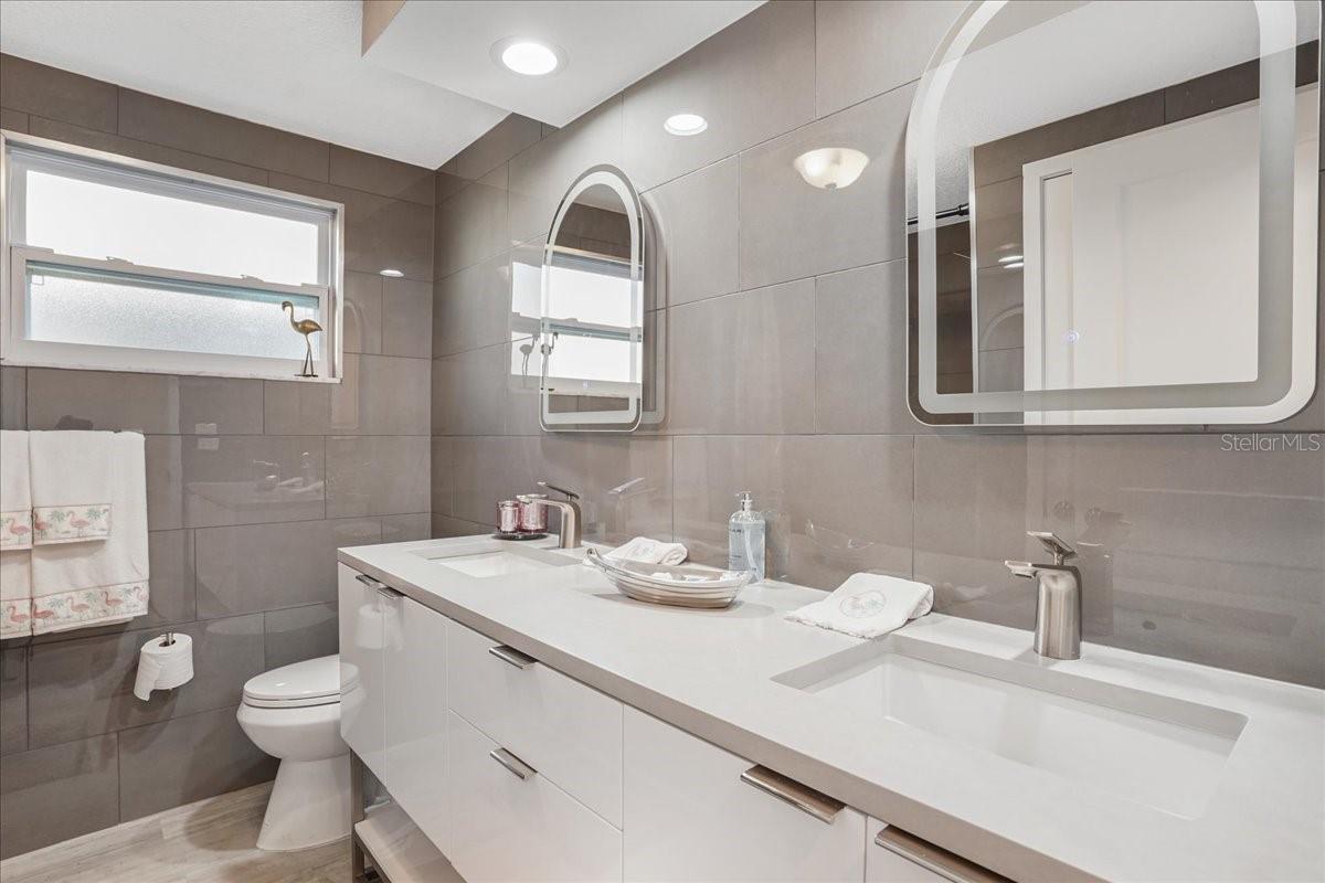 bathroom 2 - dual vanity with lighted mirrors