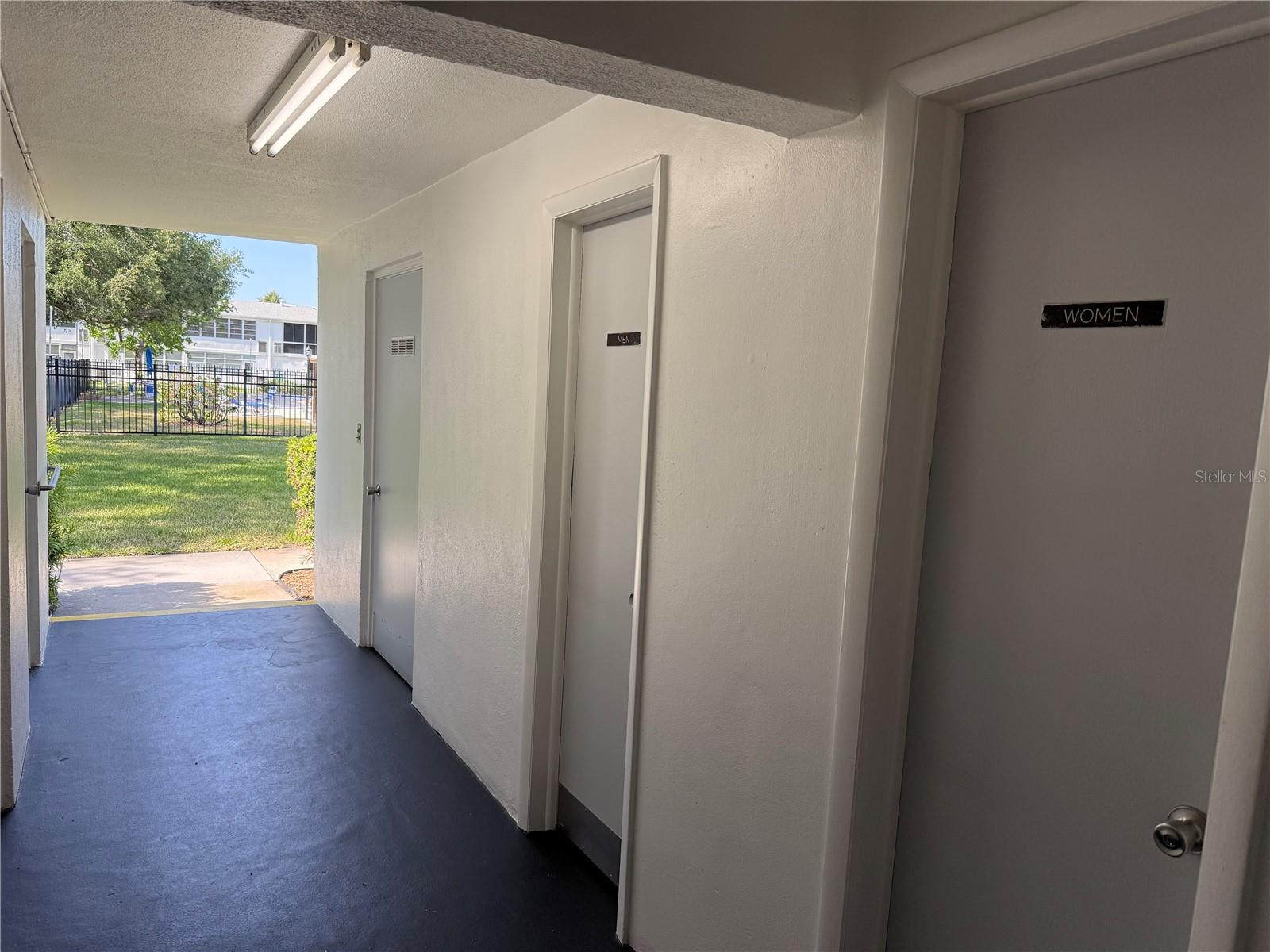 Bathrooms next to the laundry area.