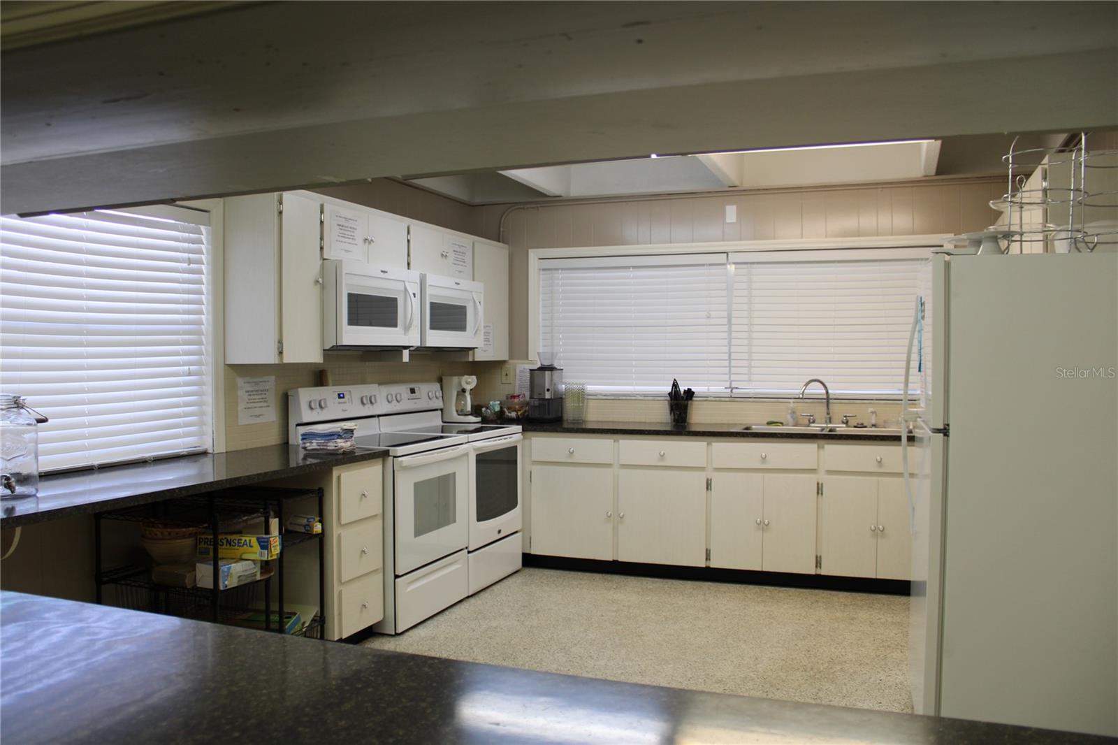 Clubhouse kitchen with double ovens and microwaves
