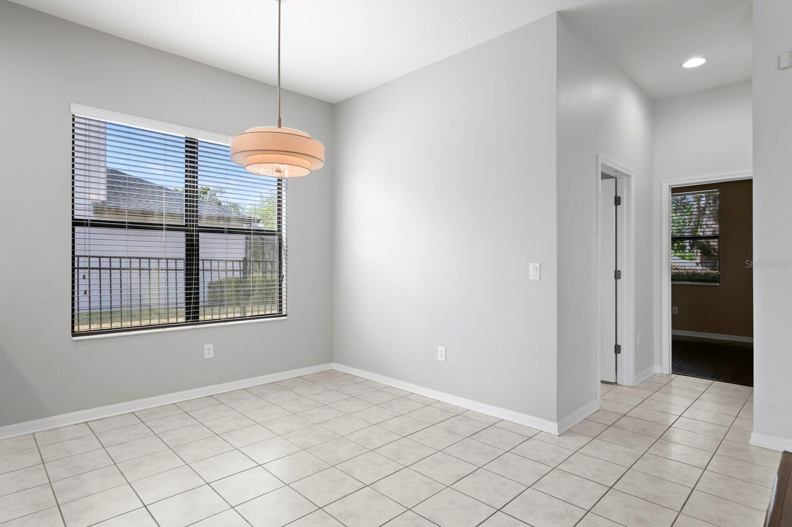 Casual dining area leads to 1st floor half bath and private office