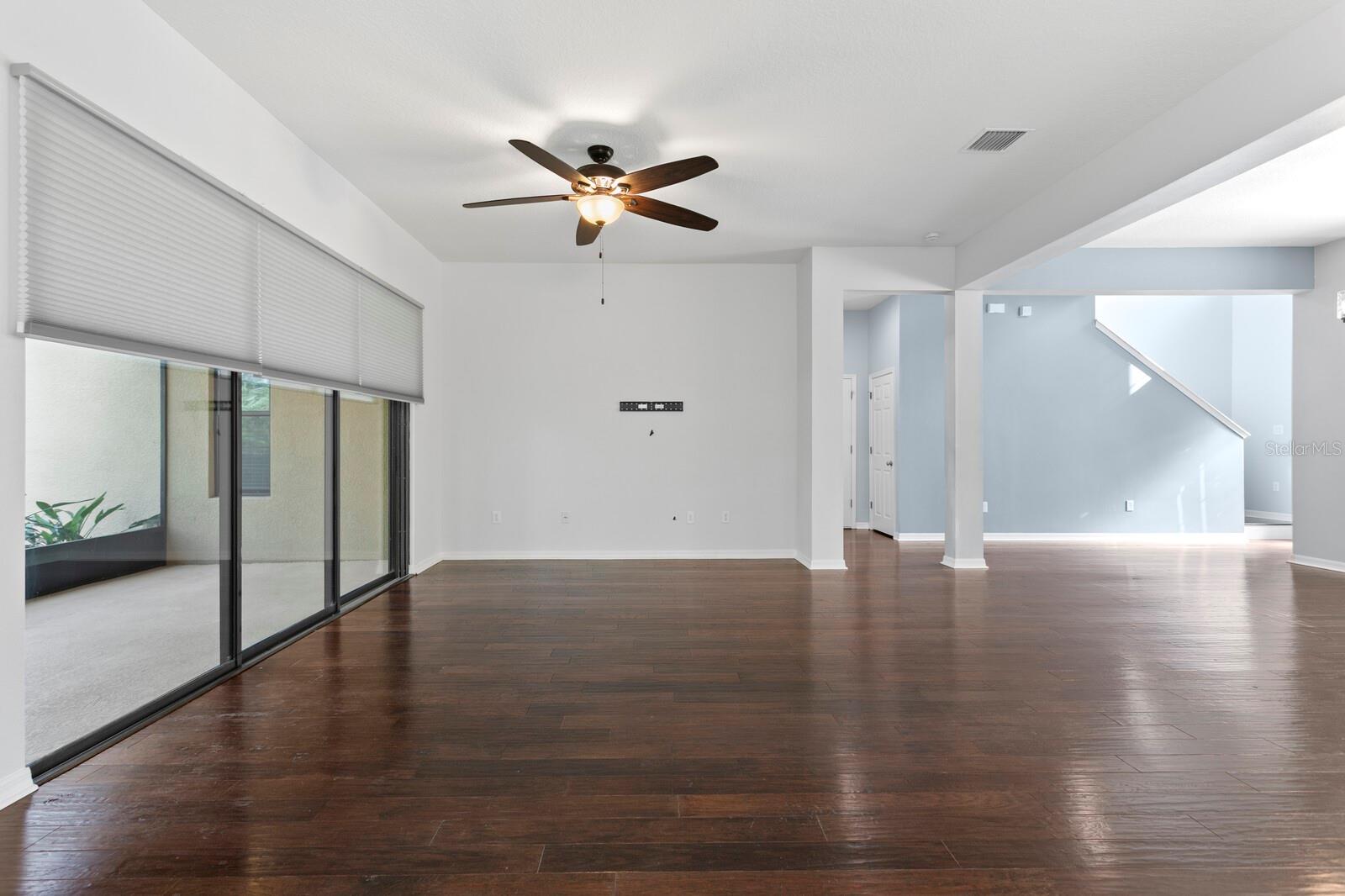 Head back through the family room to the 1st floor primary suite
