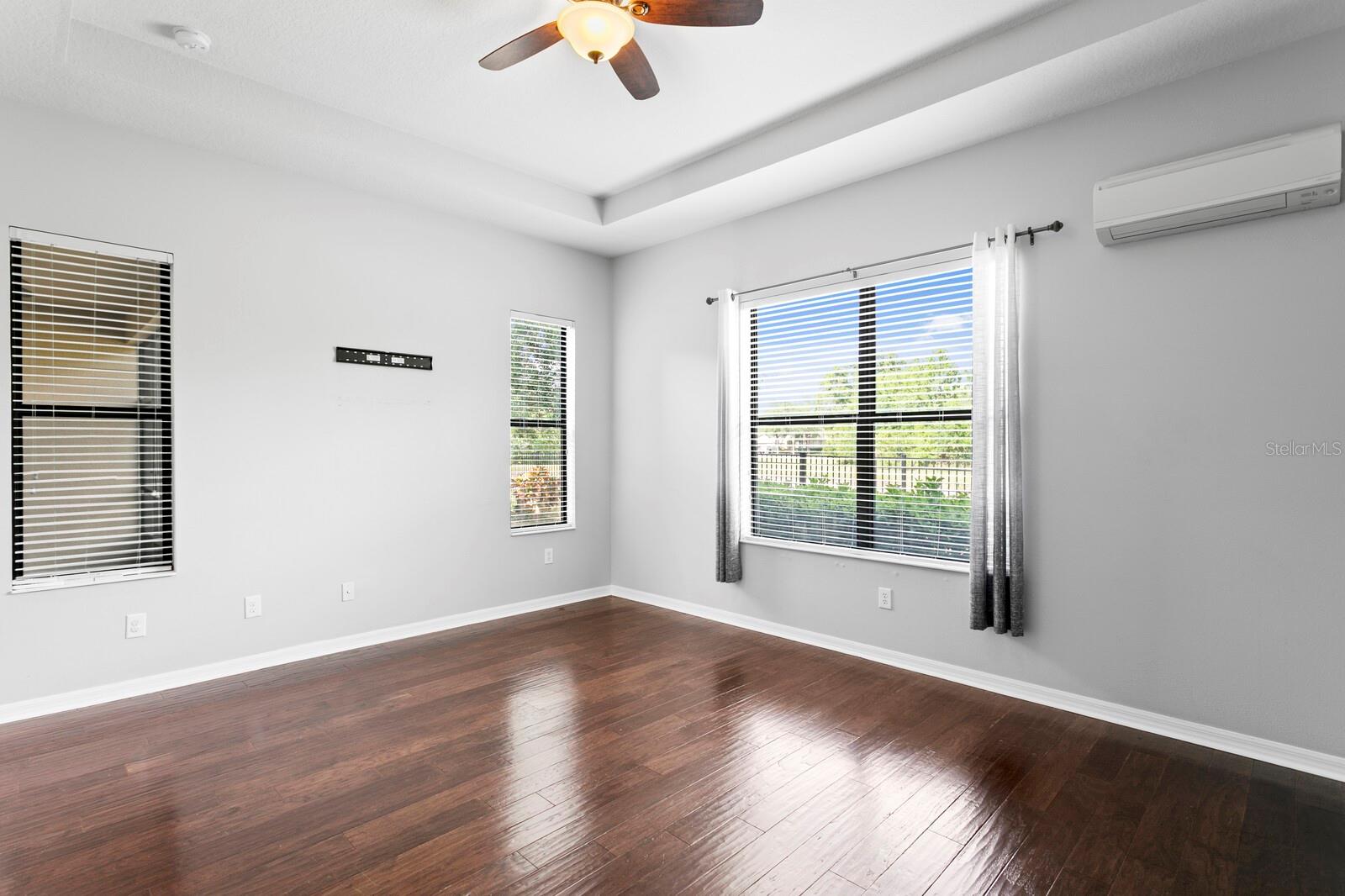 The large primary suite has tons of great natural light and water views