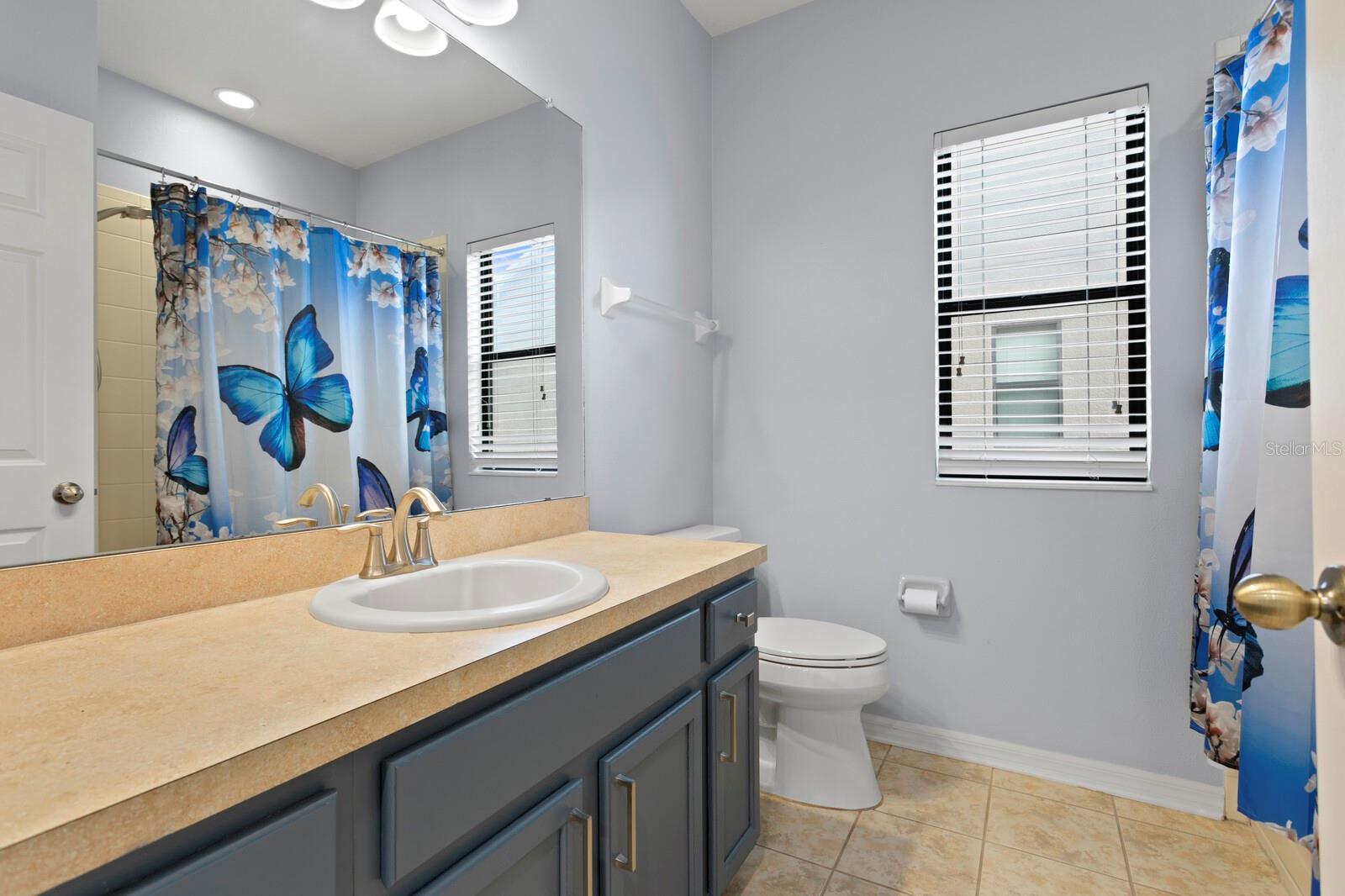 The 3rd full bath is shared between bedrooms 3 & 4 and includes a tub/shower combo