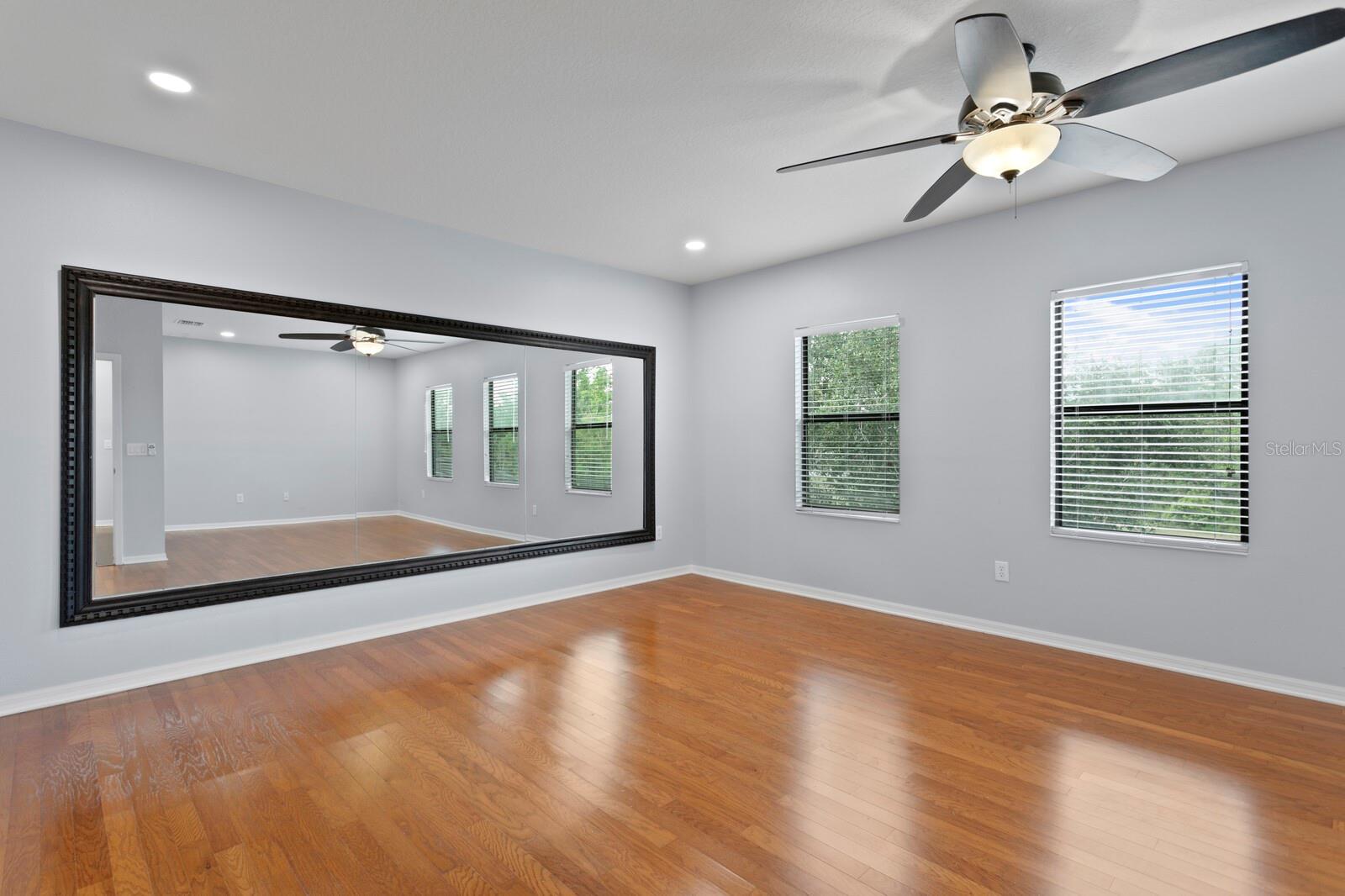 The huge bonus room with custom hardwood floors - makes for a perfect dance studio or game room