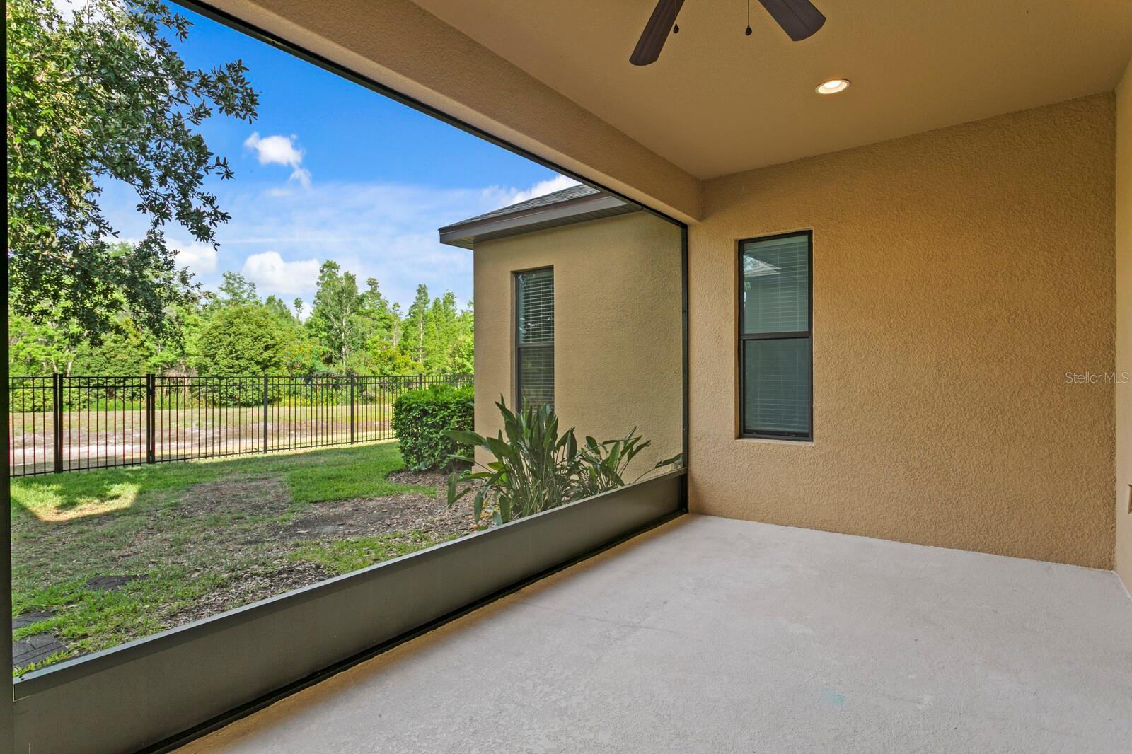 Enjoy backyard views from your screen enclosed lanai