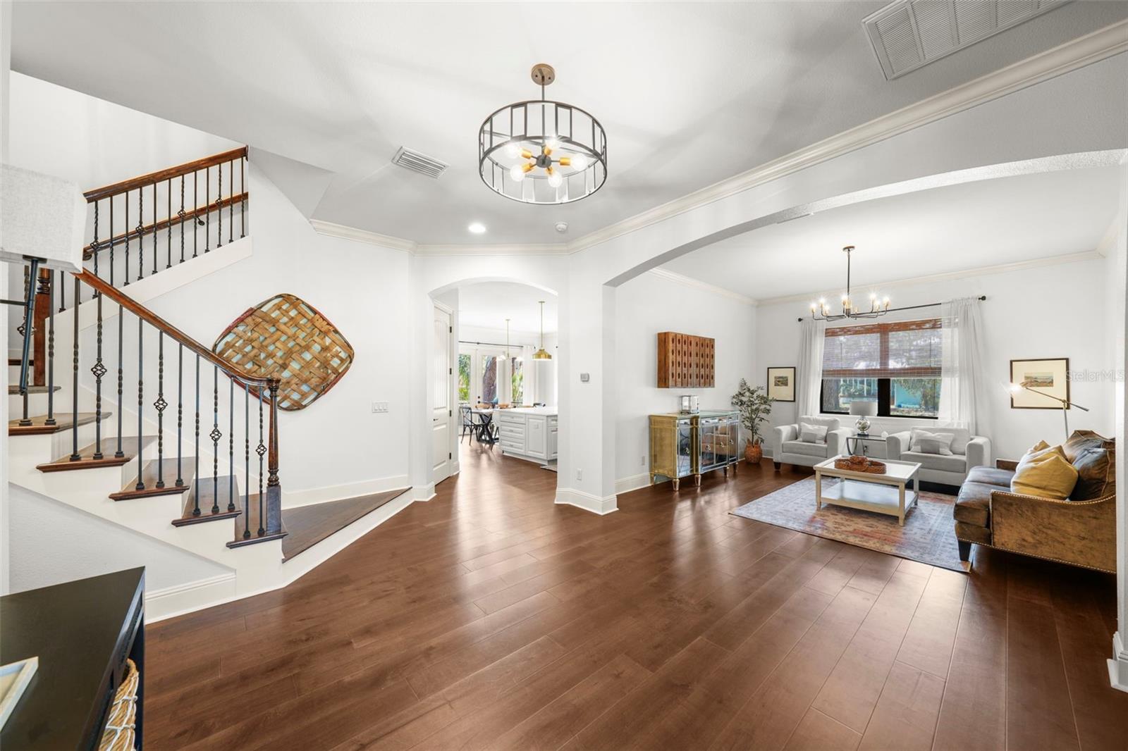 Beautiful wood floors, high ceilings and enhanced finishes