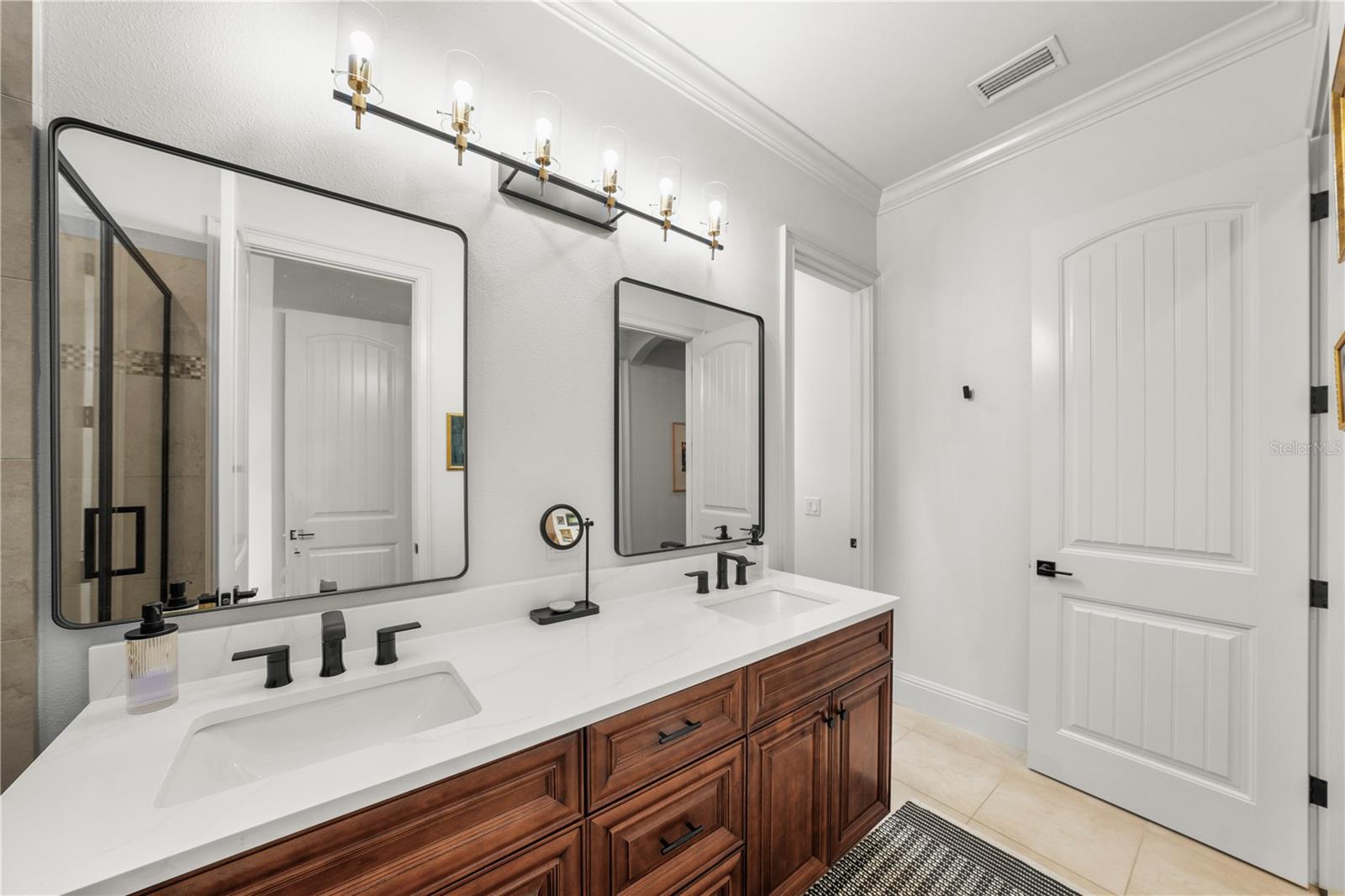 features walk in shower and double sink vanity