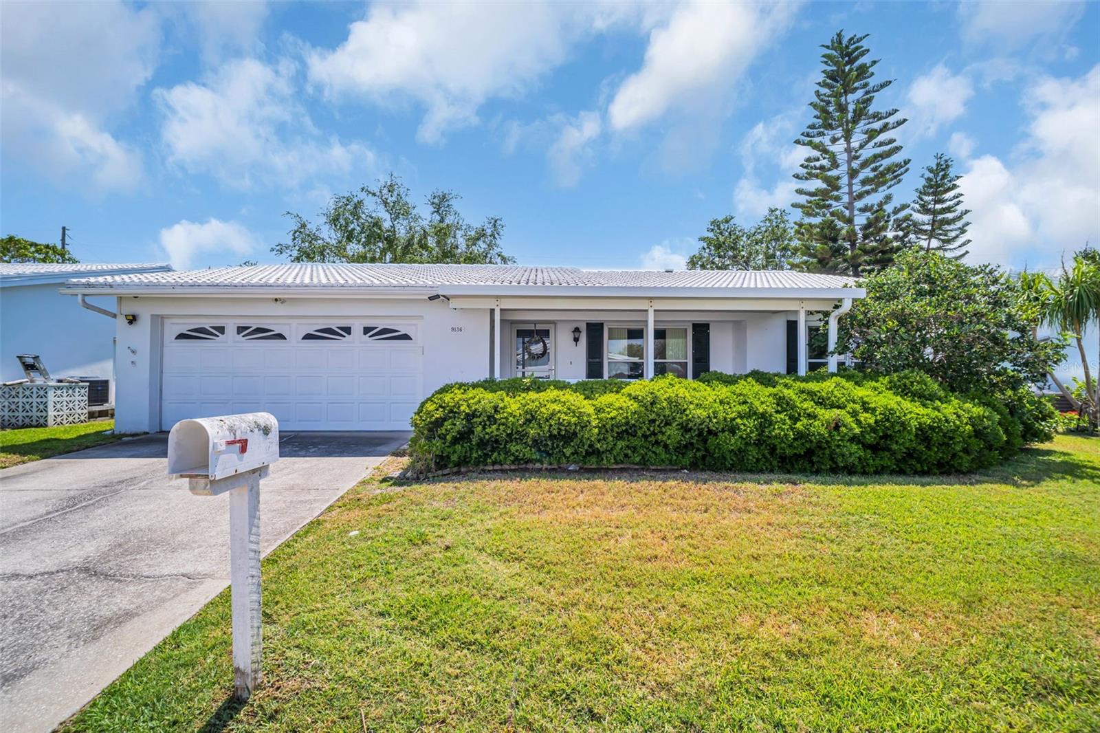 Front of house, driveway, 2-car garage