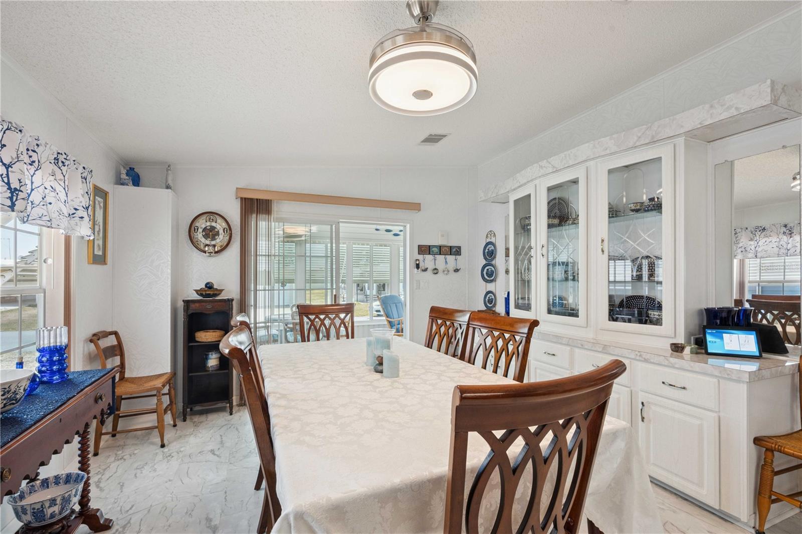 Dining area is open with kitchen and has built-in storage.
