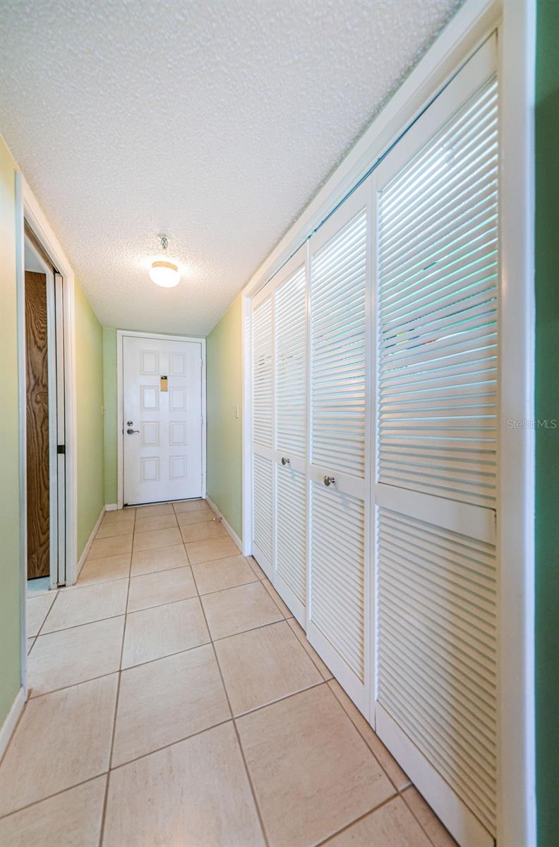 Entryway with large Laundry Closet!
