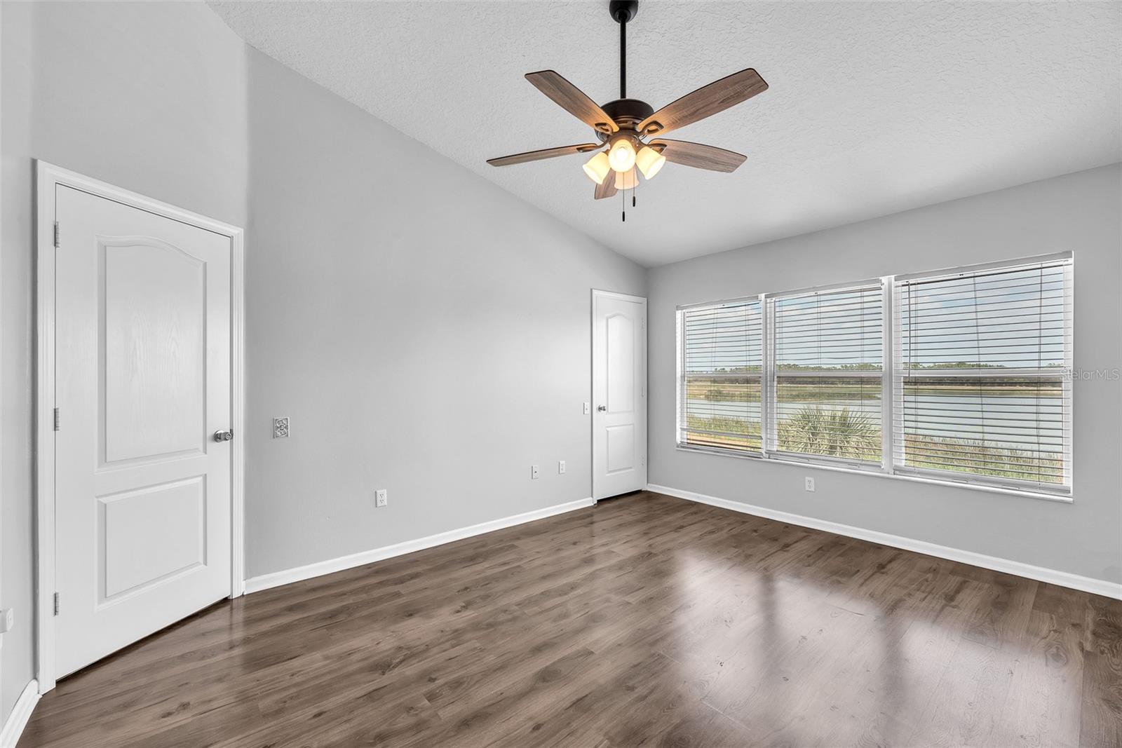 Upstairs you find the large owners’ suite featuring breathtaking water views, durable laminate flooring, walk-in closet, and en-suite bathroom.