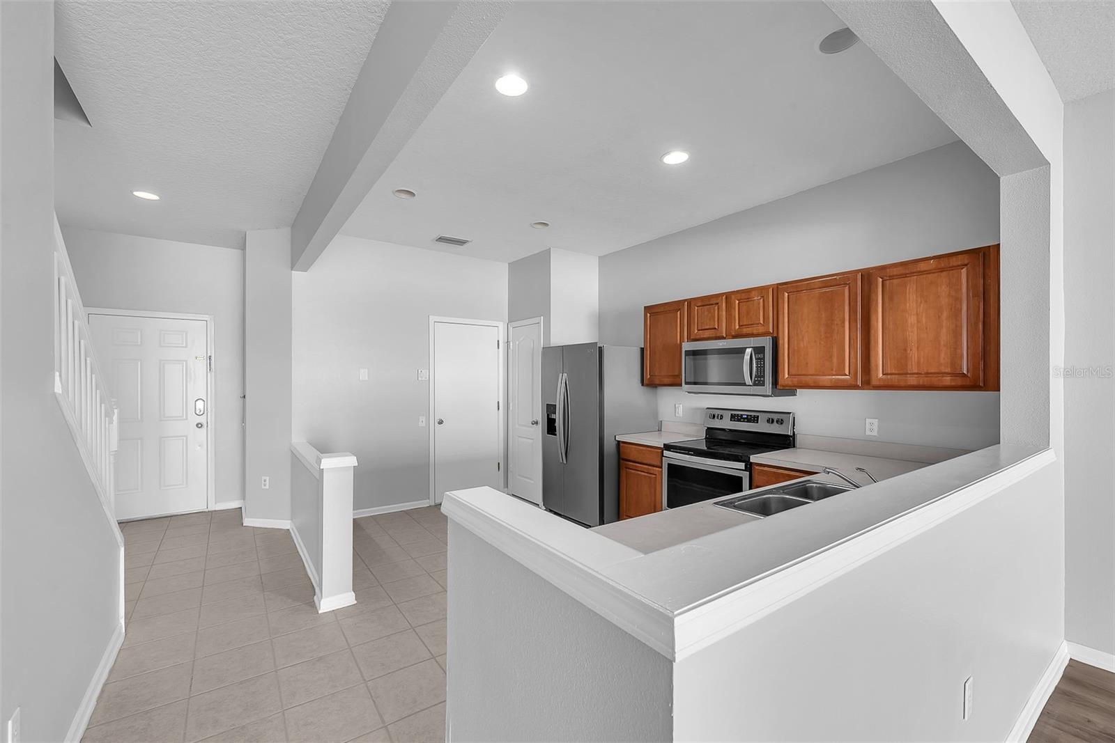 There is space in the kitchen for a casual dinette table and there is direct access to a 1-car garage.