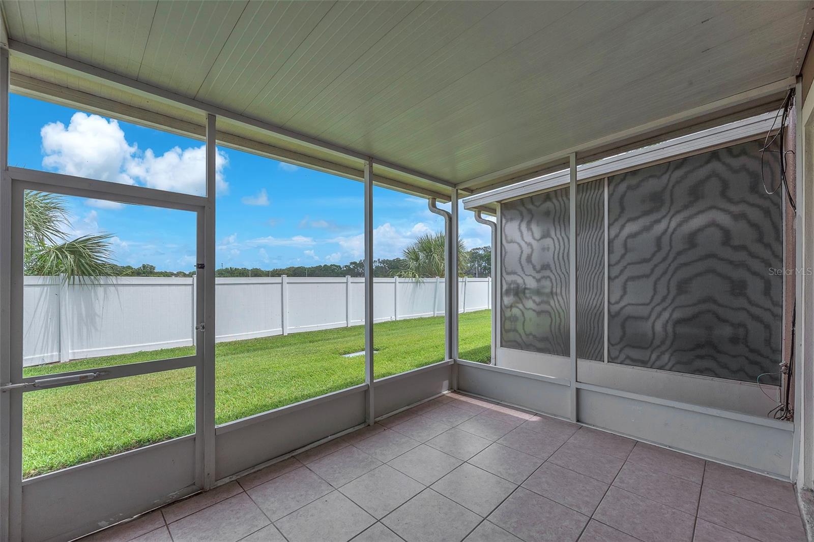 A sliding glass door leads to the screened and covered lanai—perfect for relaxing or entertaining in the beautiful Florida weather.