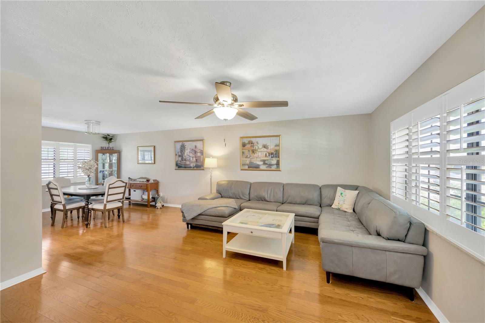 Gorgeous wood floors and an abundance of natural light create an inviting atmosphere in the living and dining rooms.