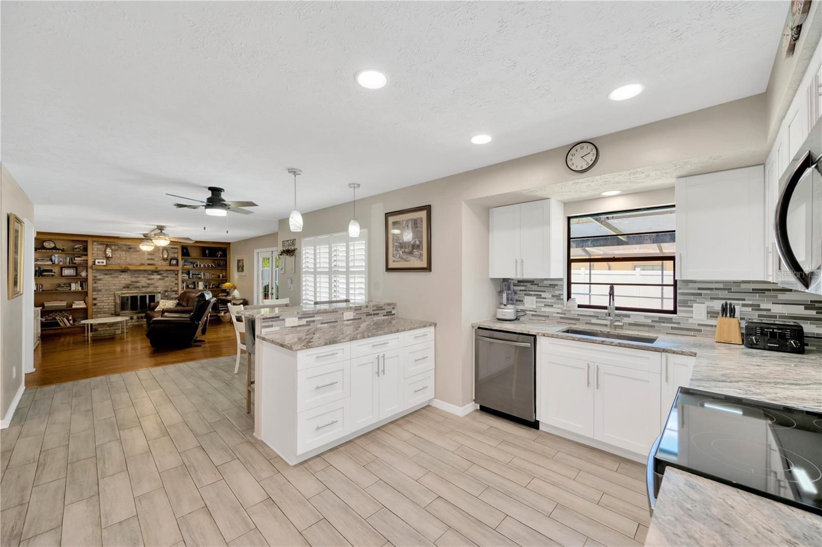 The kitchen floor is a wood grained look durable tile.