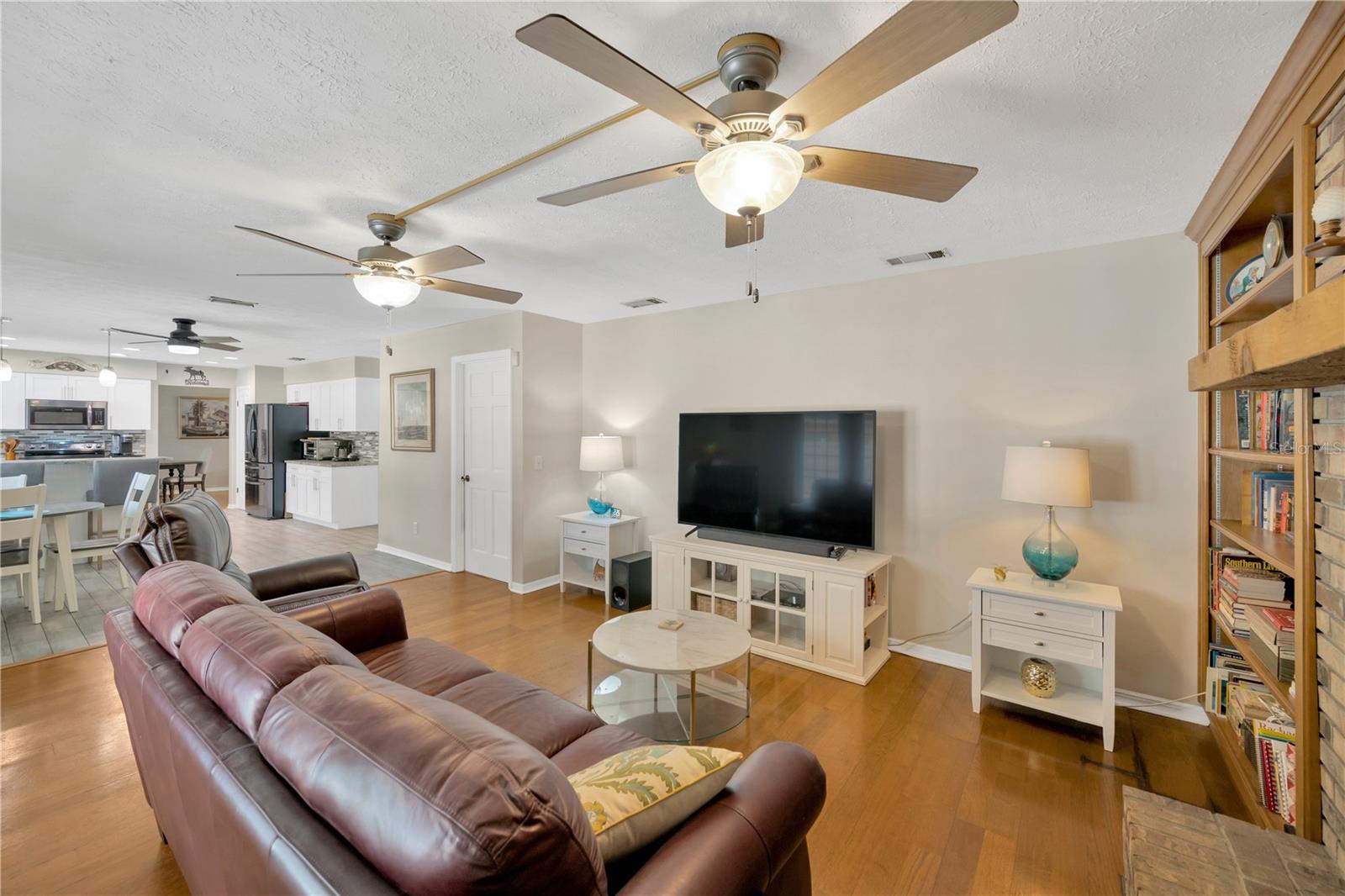 The family room is open to the kitchen and has access to the laundry room and the garage.